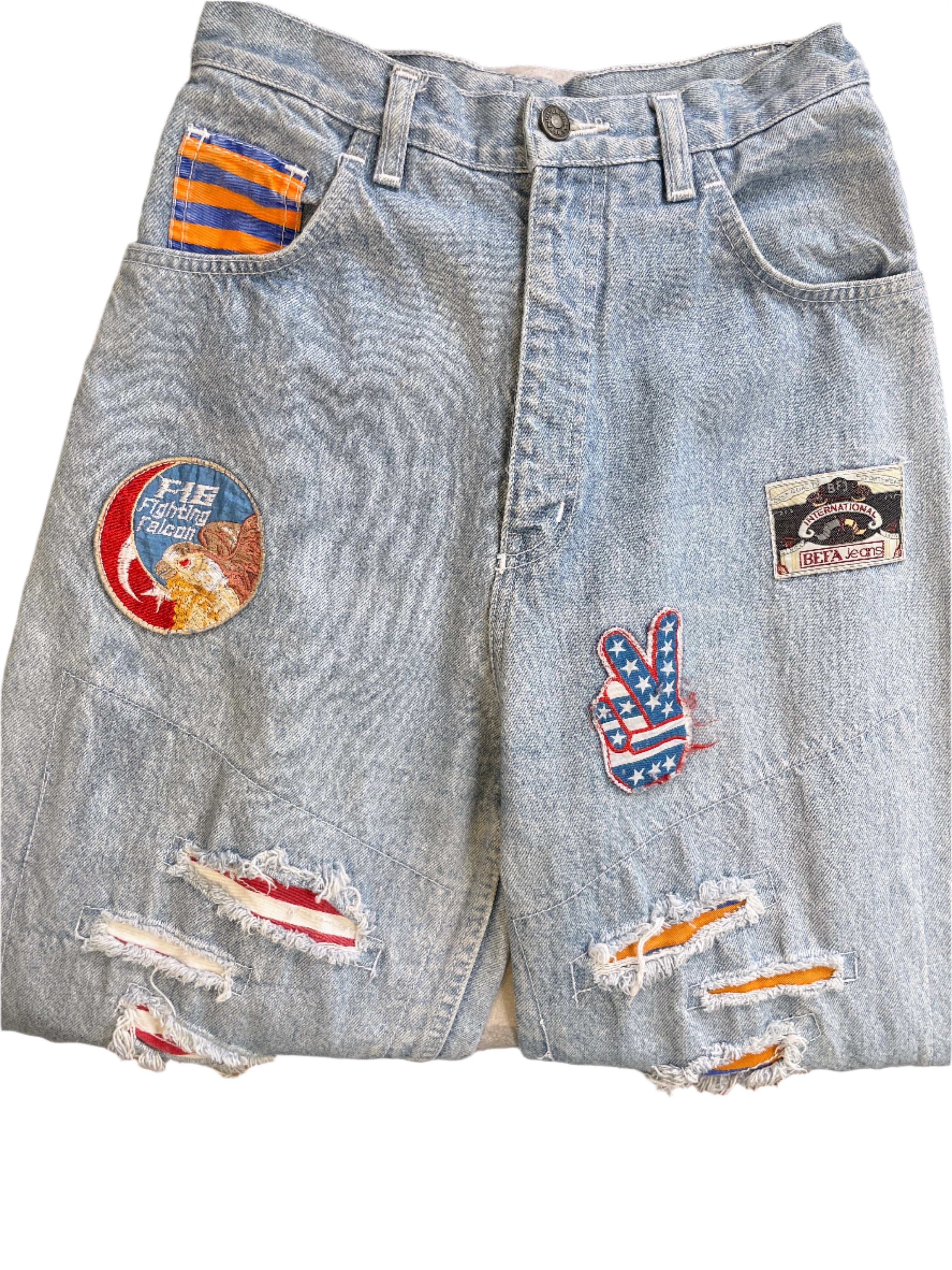 Front view of BEFA jeans with various patches and distressing