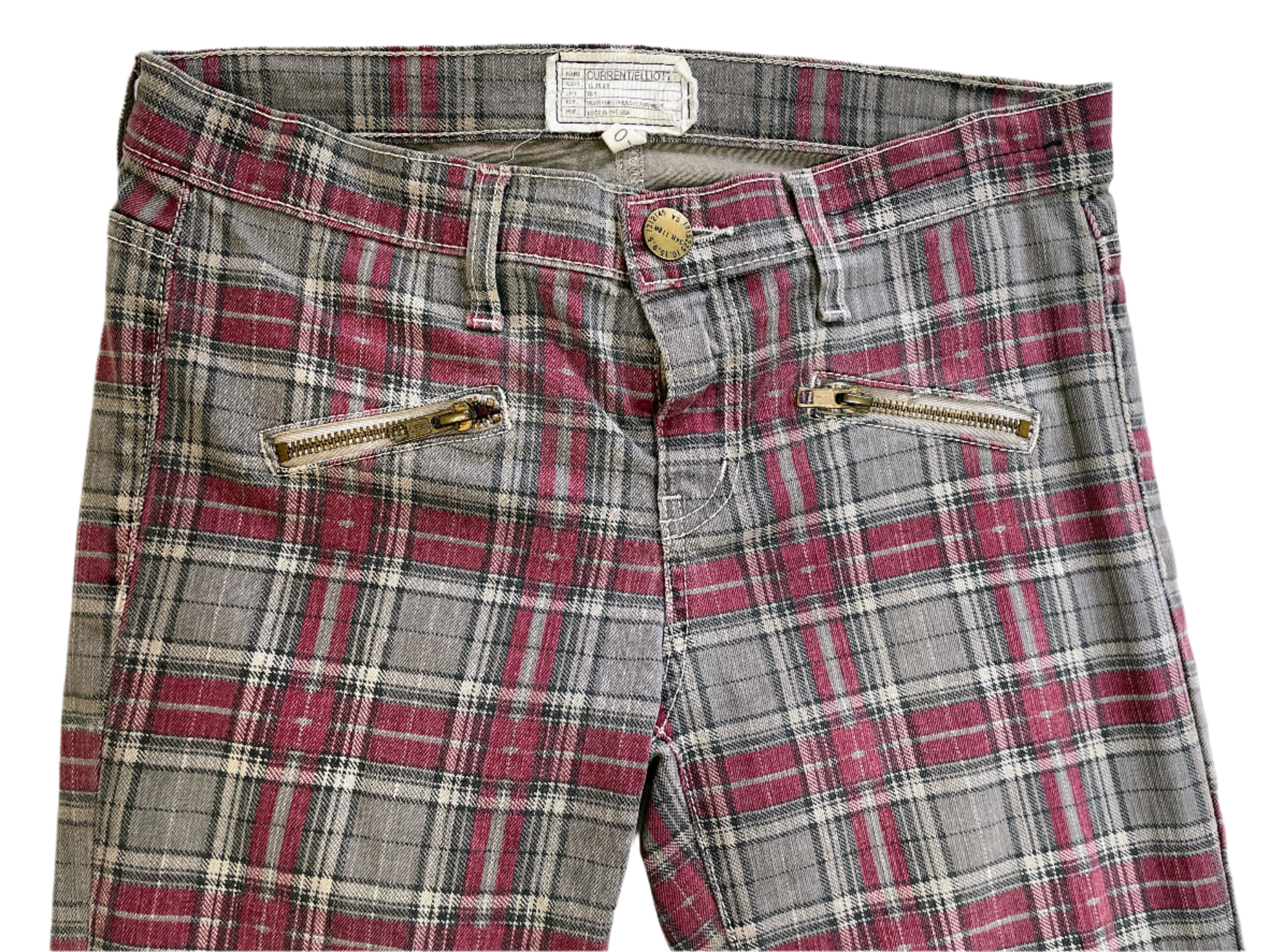 Plaid jeans with gold zippers on a white background