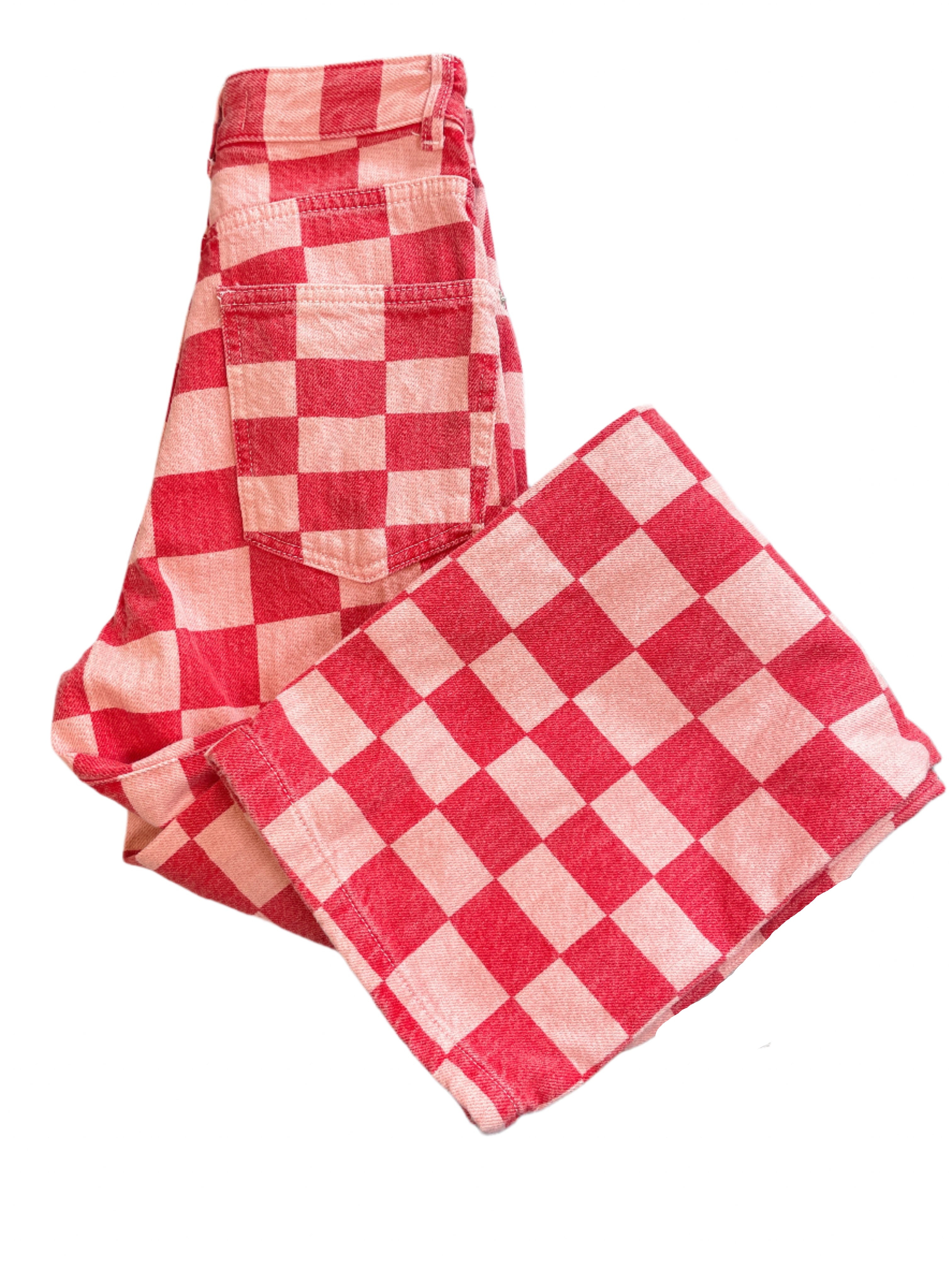 Zara red and pink checkered bell bottom jeans size 0 from The Hunting Party studio wardrobe, folded and laid flat showing pattern and condition.