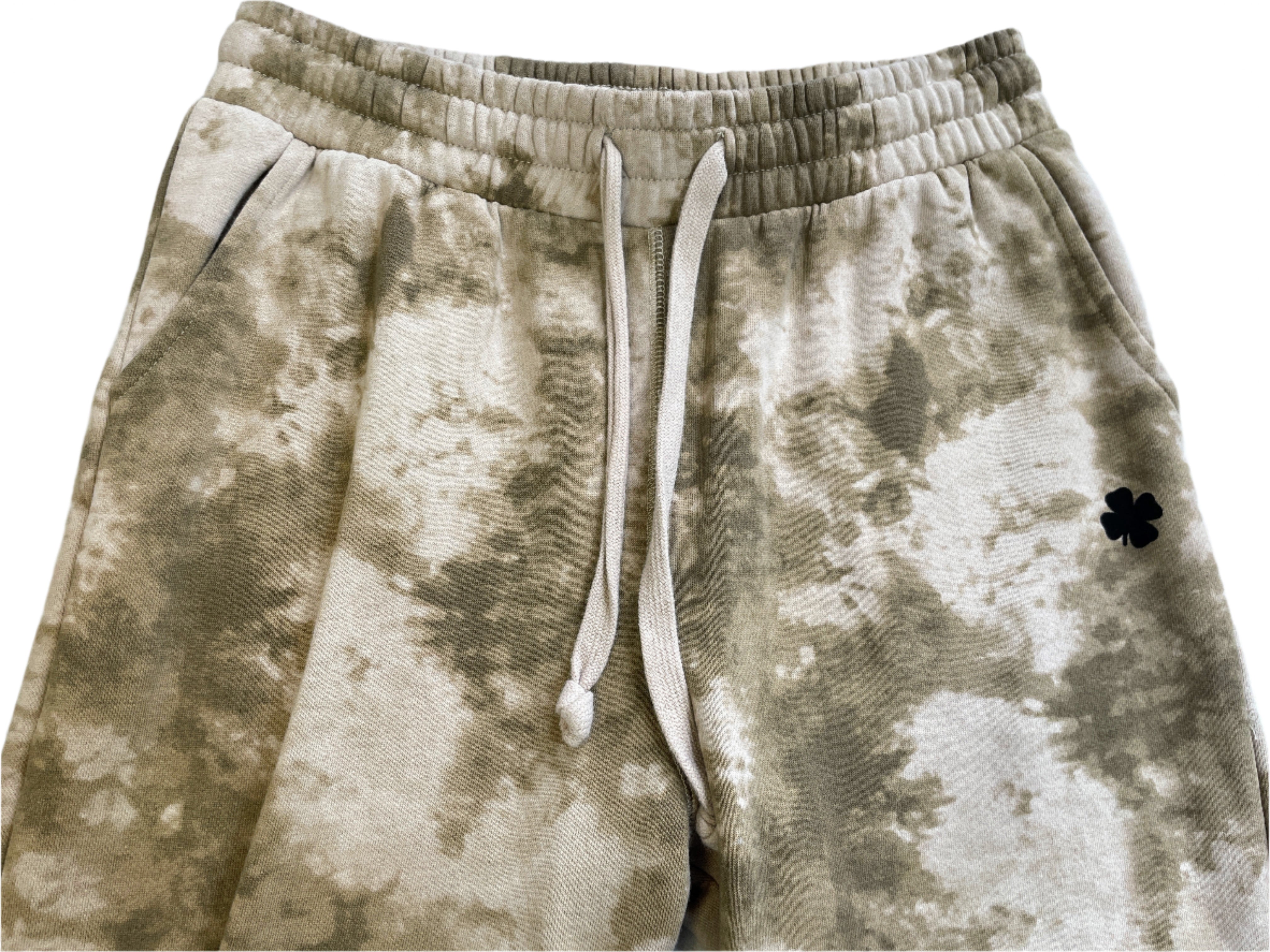 Tie-dye sweatpants with a drawstring on a light blue background