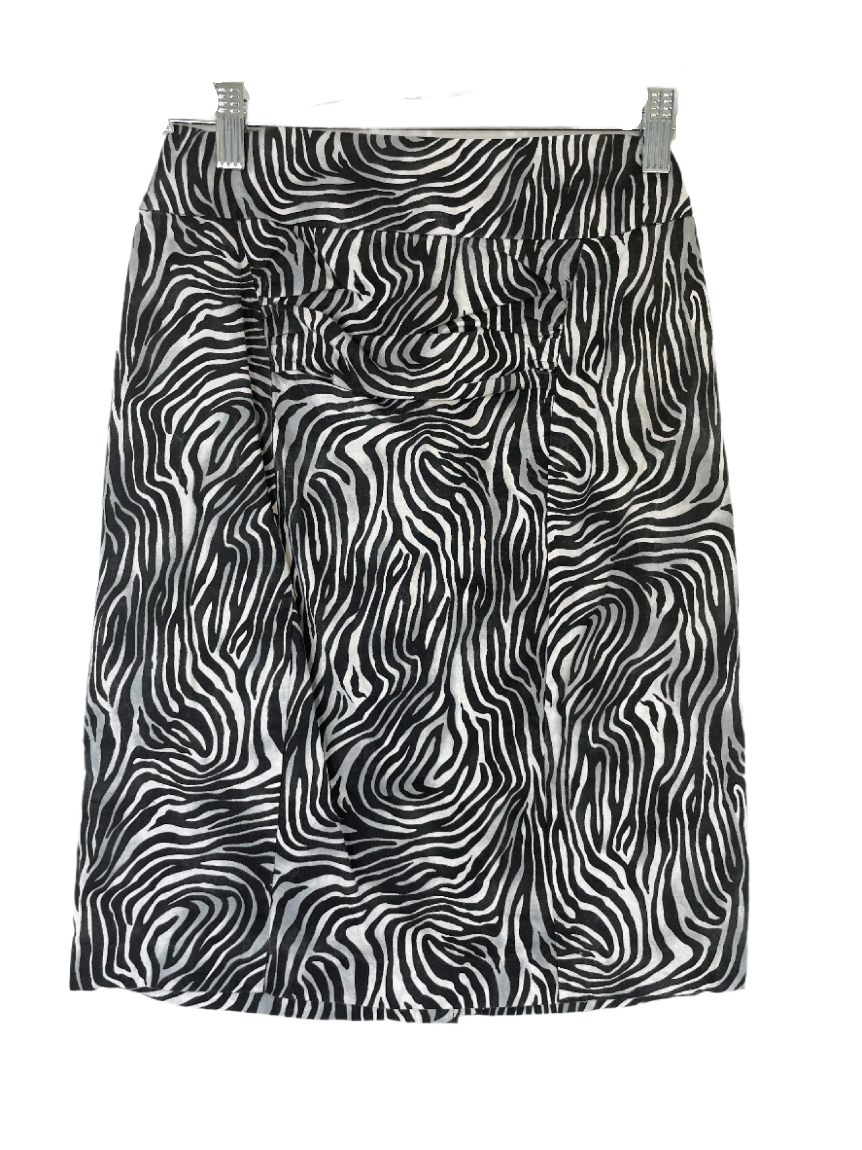 Zebra print skirt in black and white with back slit and no visible tags, size small.