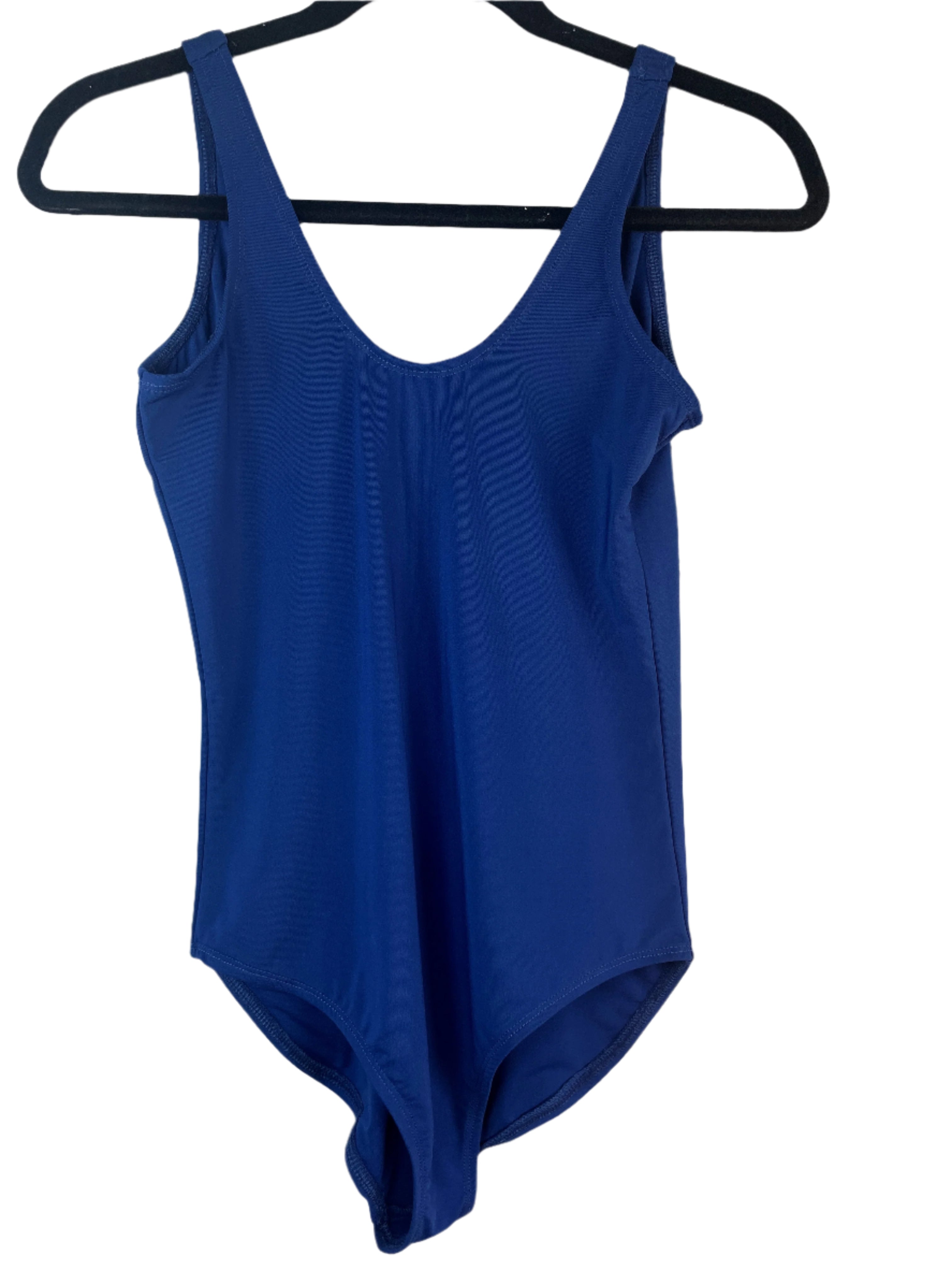 Blue swimsuit on a hanger with a tag on a white background