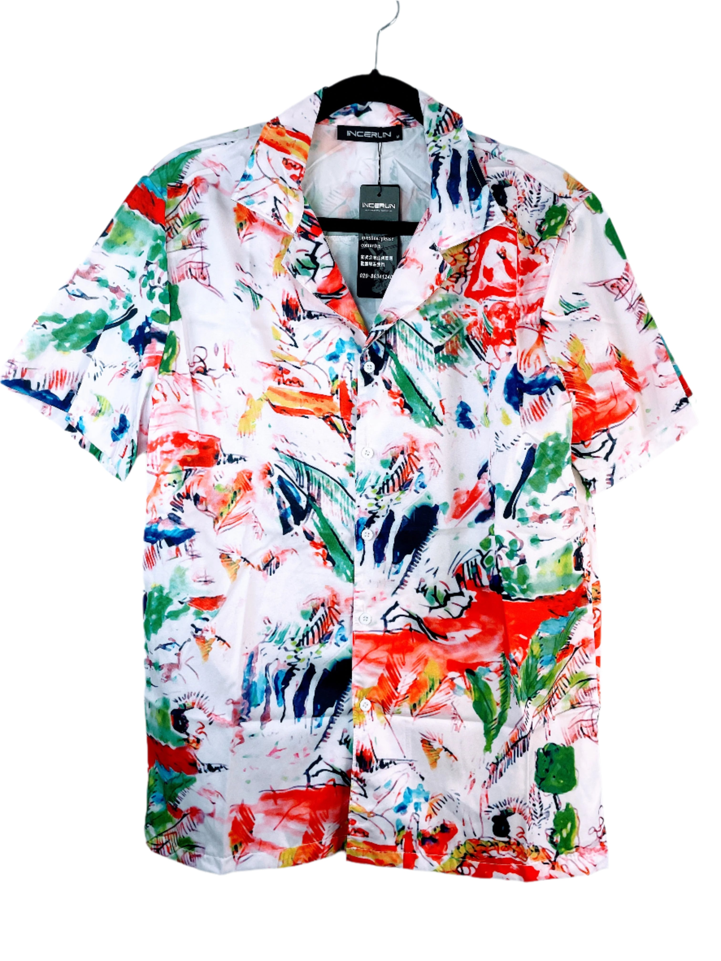 Colorful patterned shirt on a hanger against a light blue background