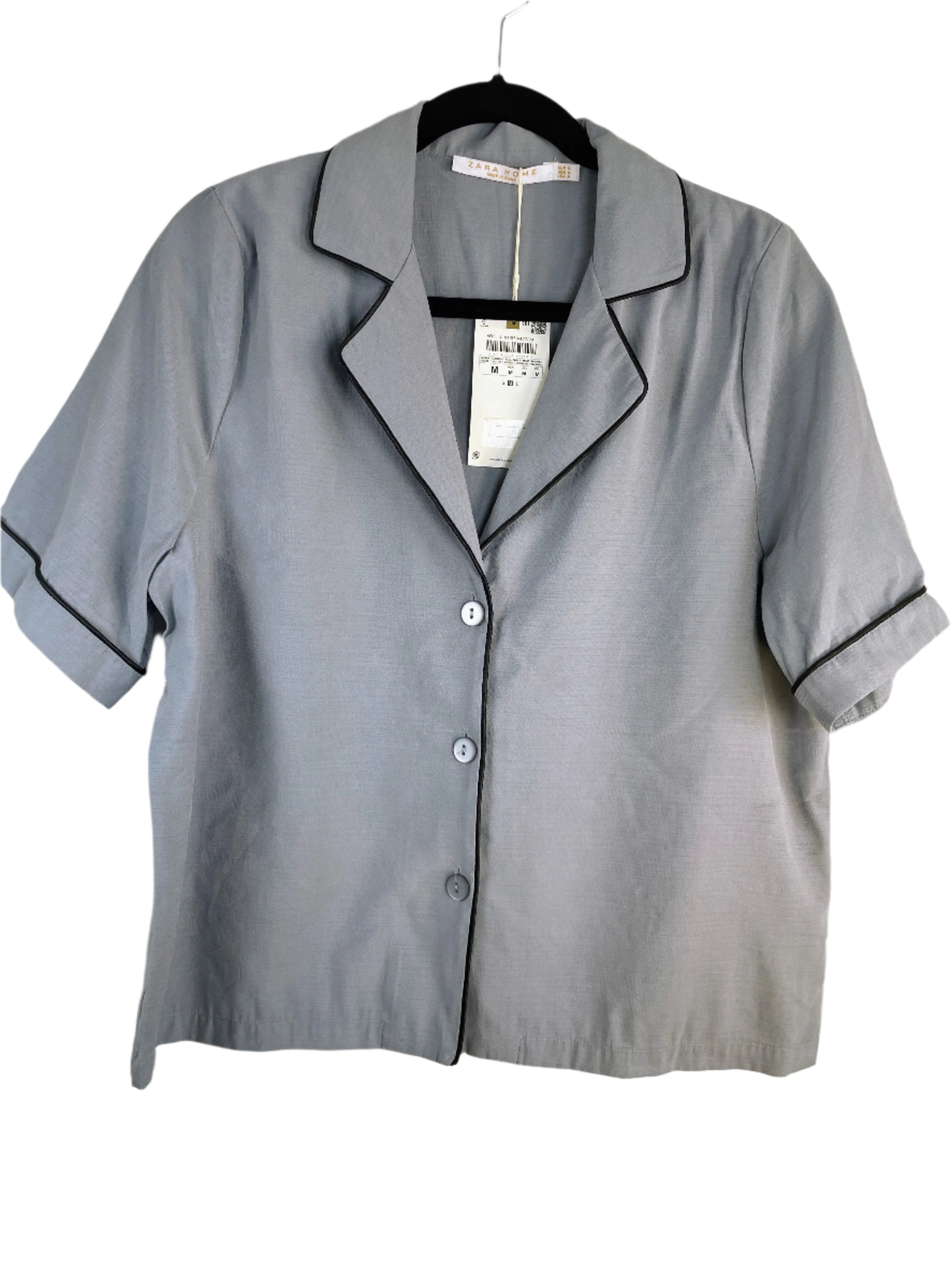 Light blue Zara Home pyjama top with navy piping, short sleeves, and button front, size medium
