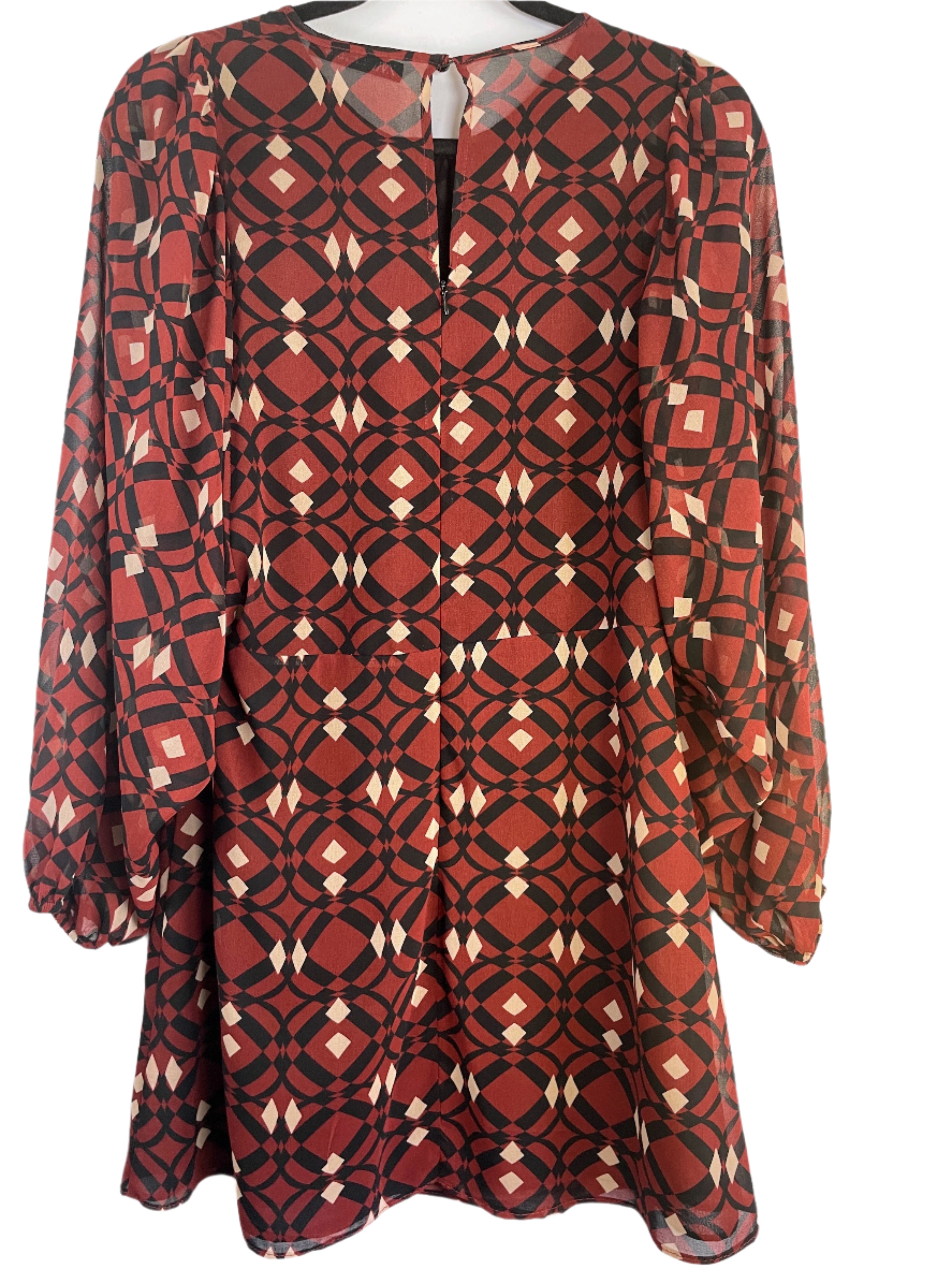 Red and black patterned dress on a white background
