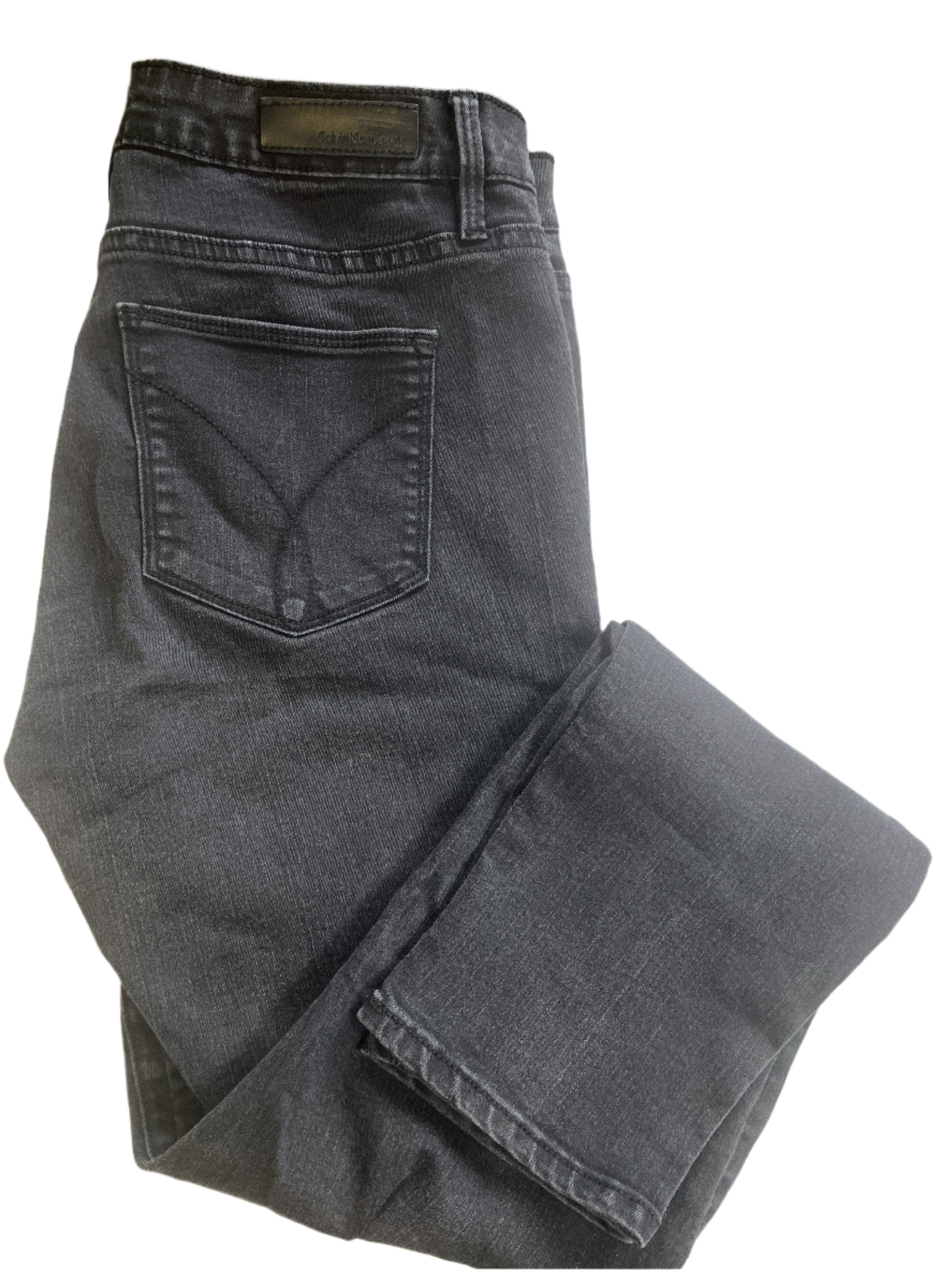 Calvin Klein black jeggings size 10, stretch fabric, flat lay photos showing front and back details