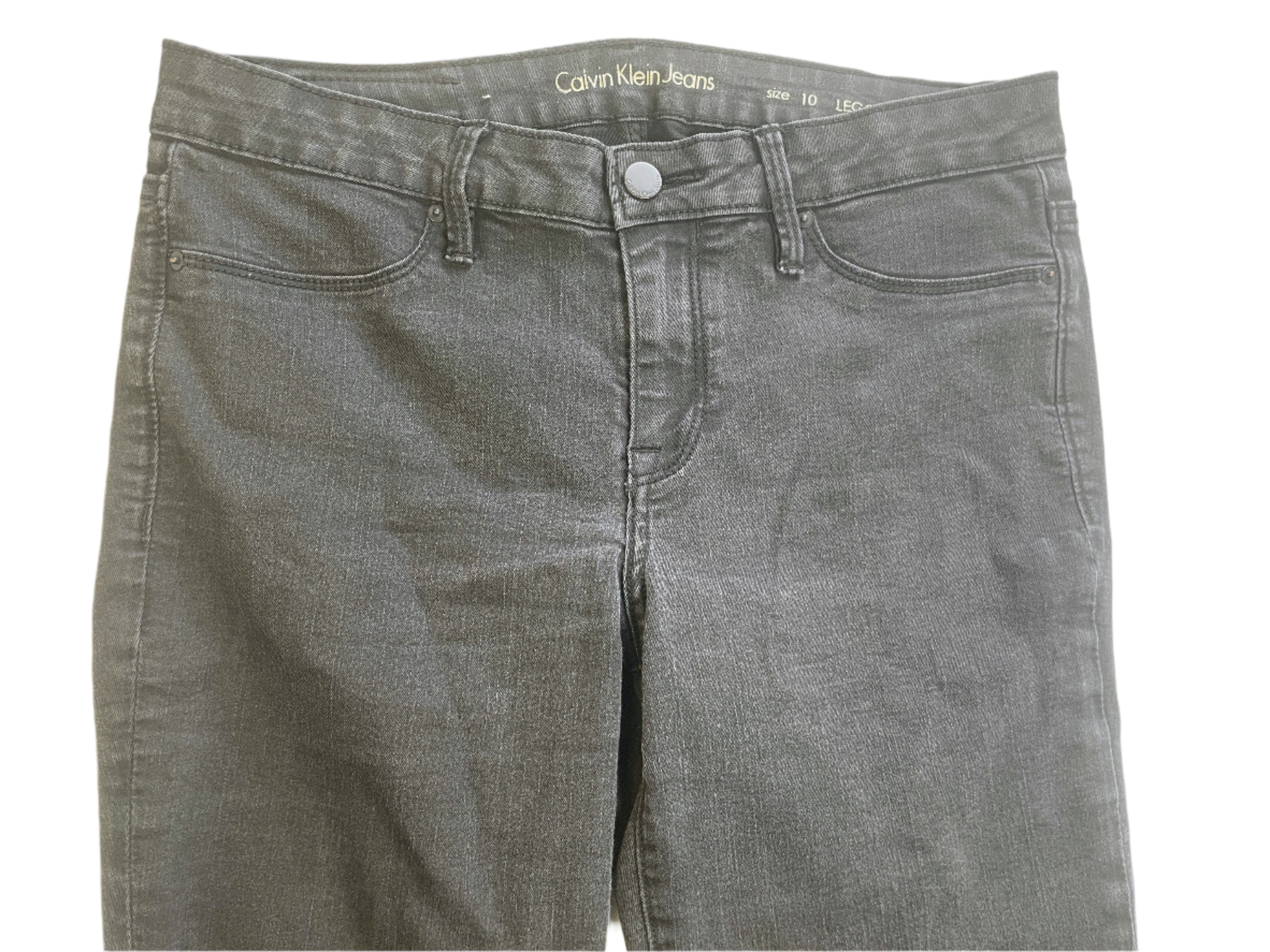 Black Calvin Klein jeggings on a white background
