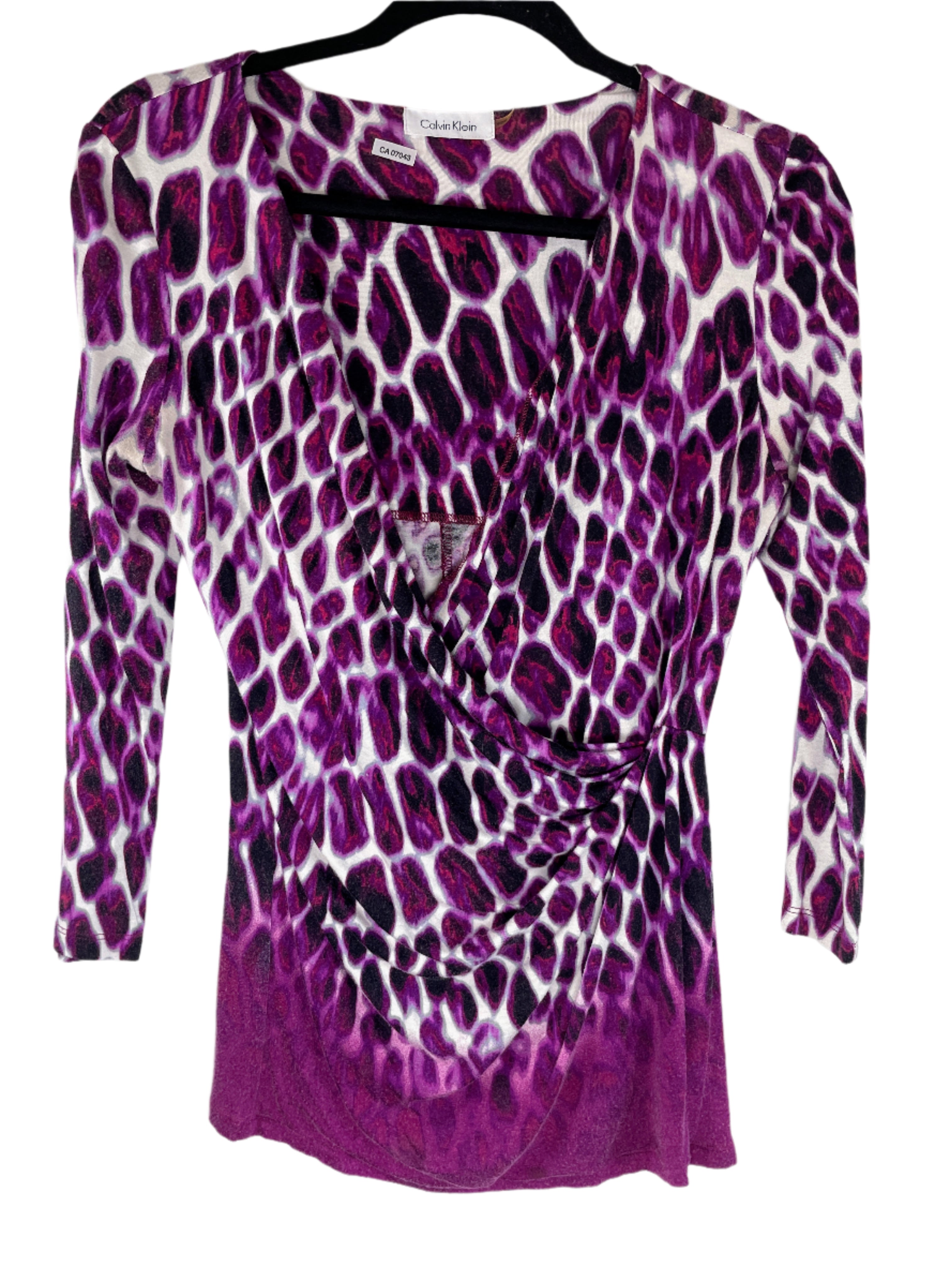 Purple leopard print long-sleeve top on a hanger with a white background