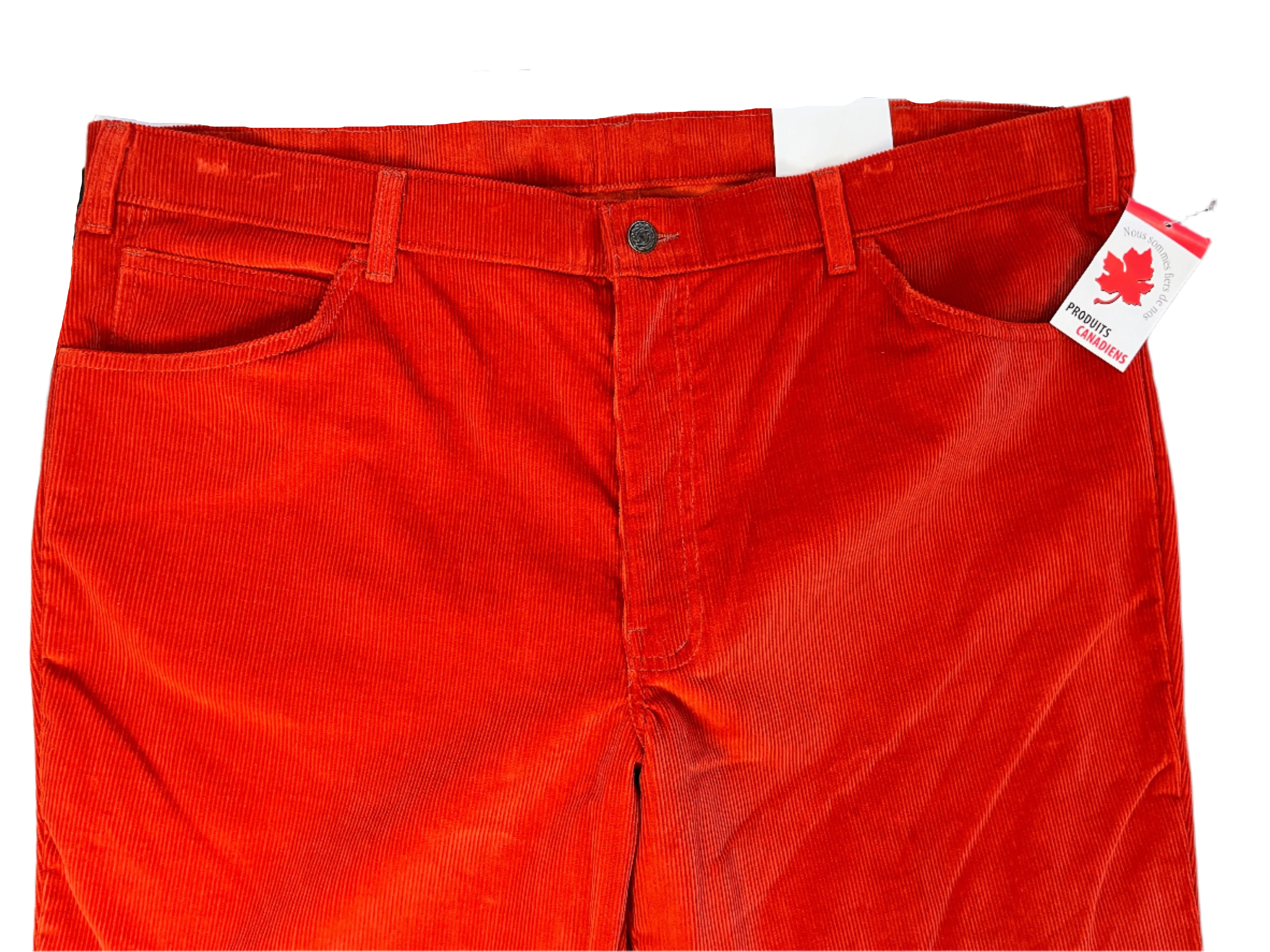 Red pants with a tag on a plain background