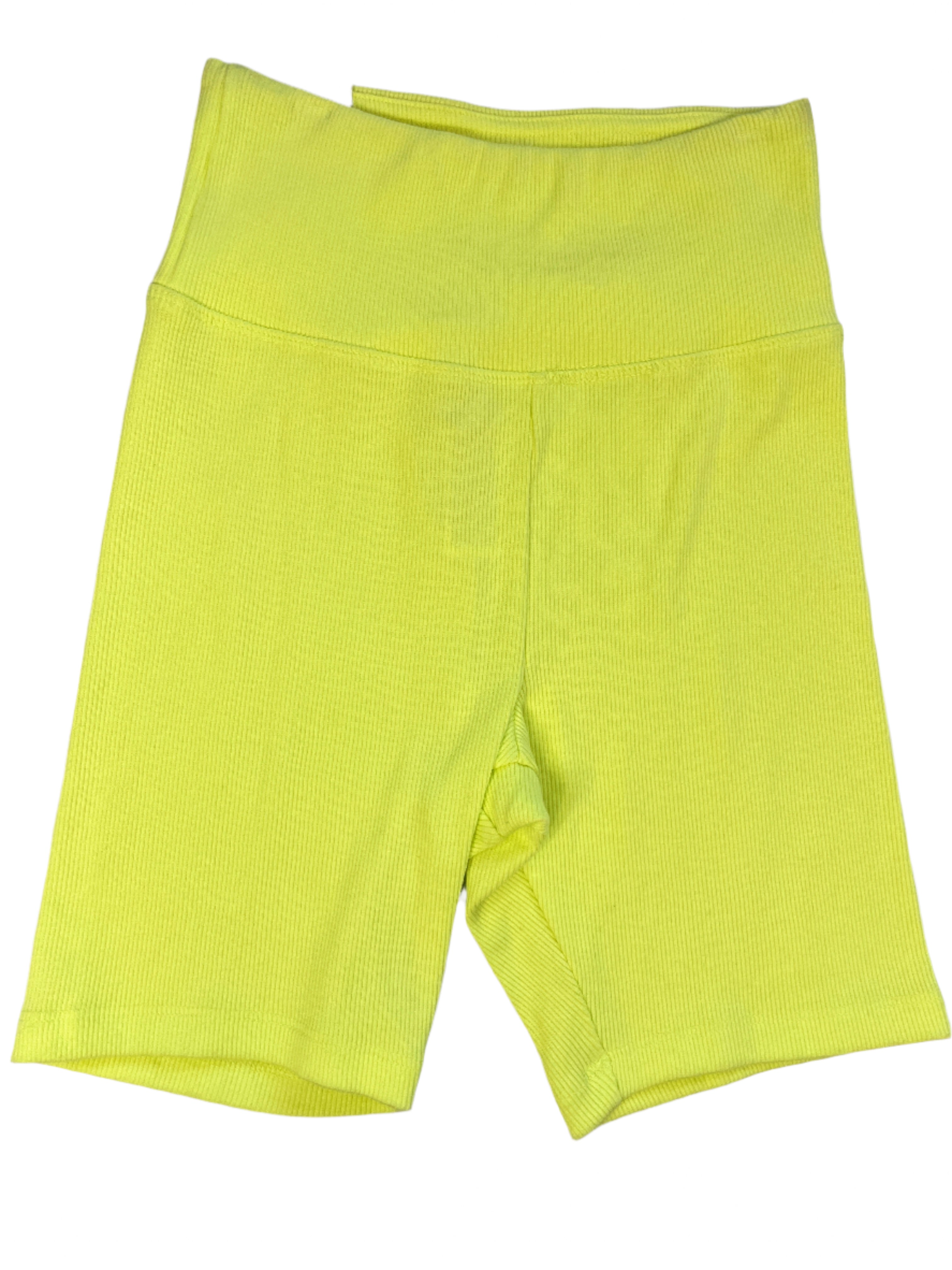 Bright yellow shorts on a gray surface