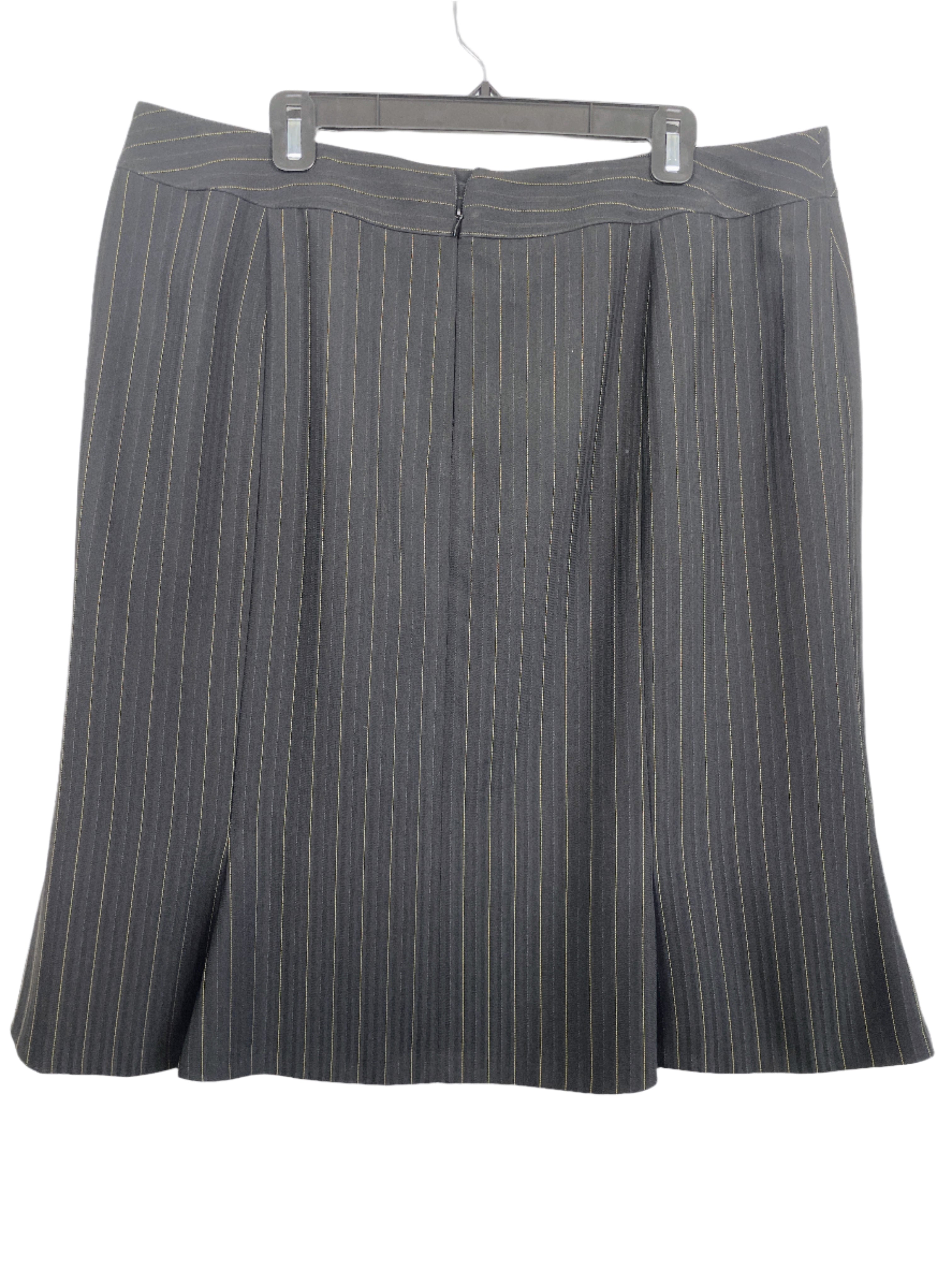 back view of Freda’s black pinstripe size 20 skirt with gold detailing, fully lined and flared hem.