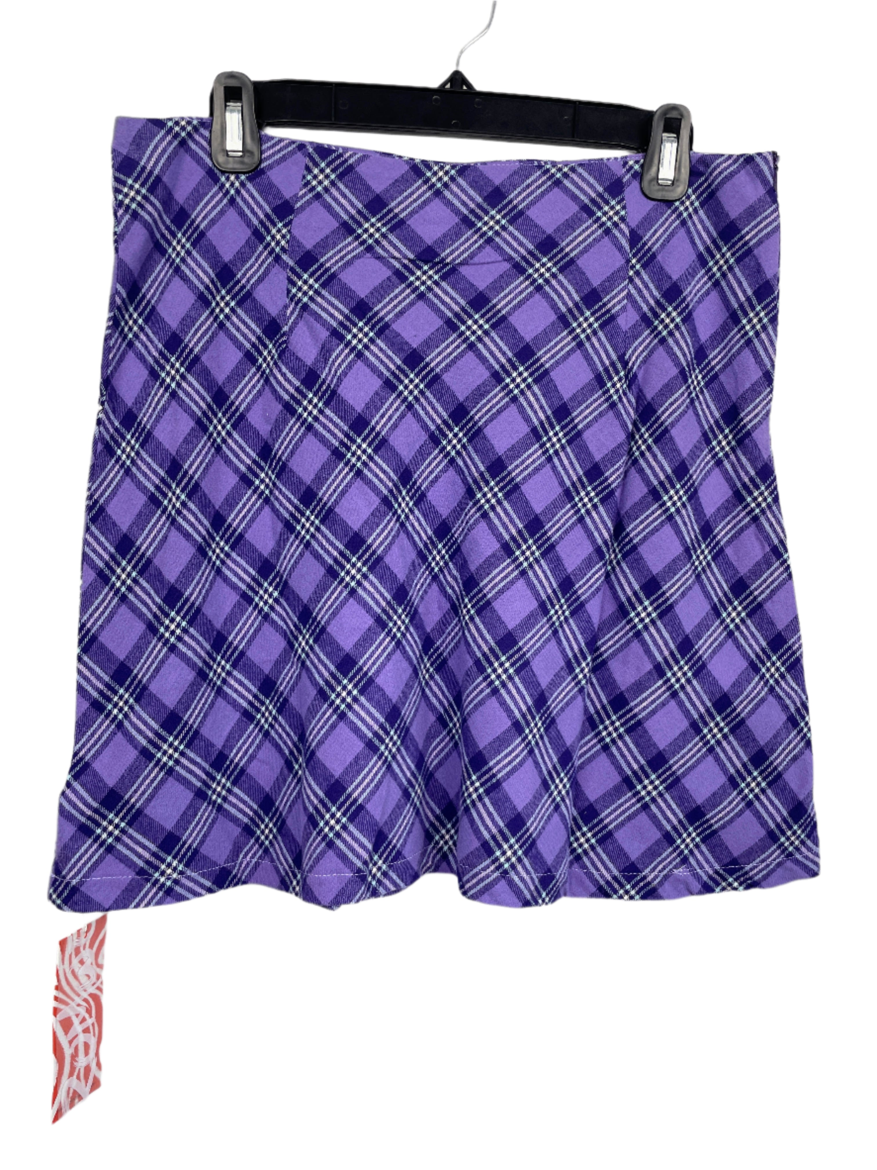 Front view of Romwe purple plaid skirt, size large, hanging on black hanger