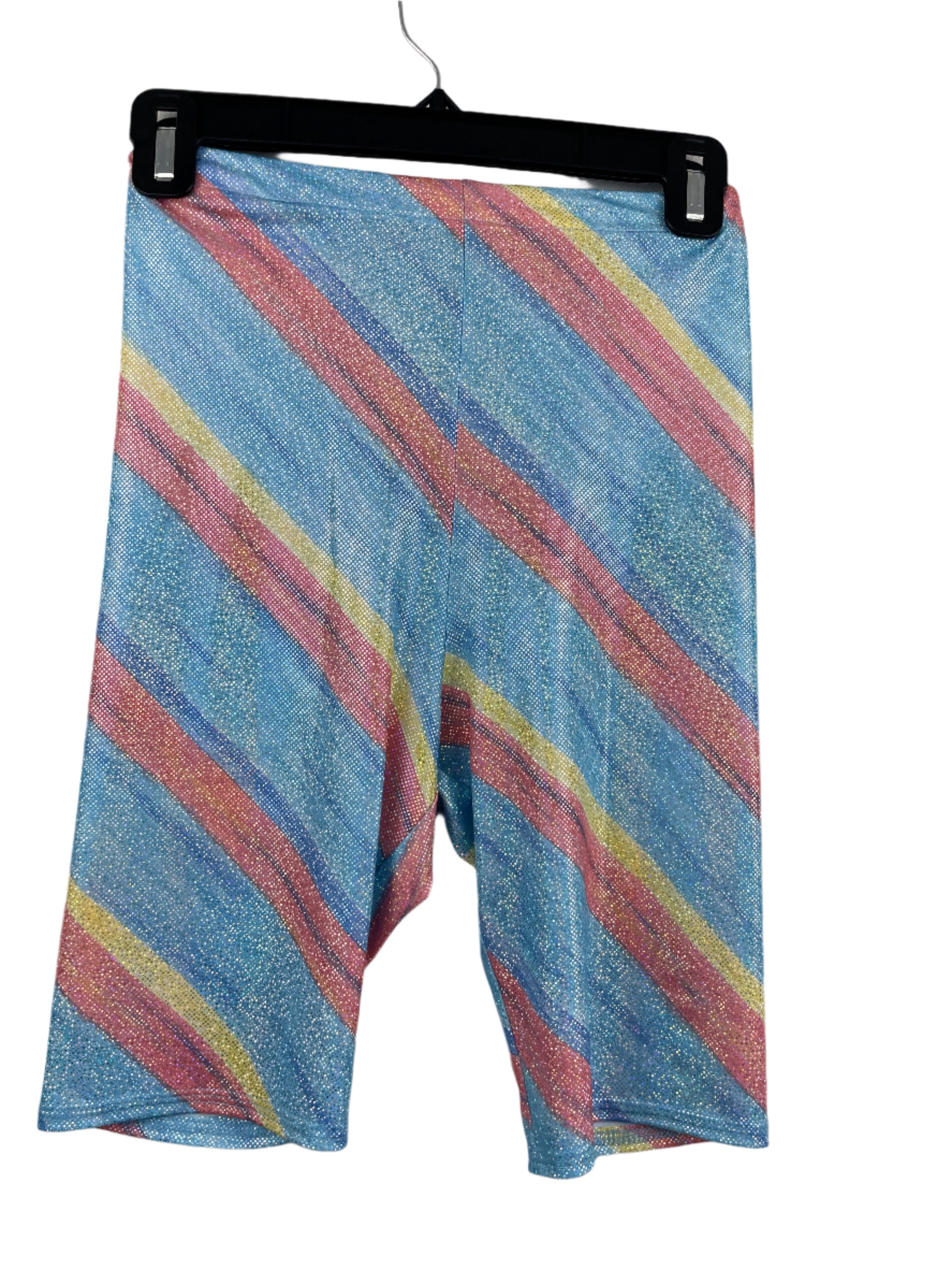 back view of sparkly striped XXS biker shorts with rainbow glitter pattern on blue background, elastic waistband, mid-thigh length.
