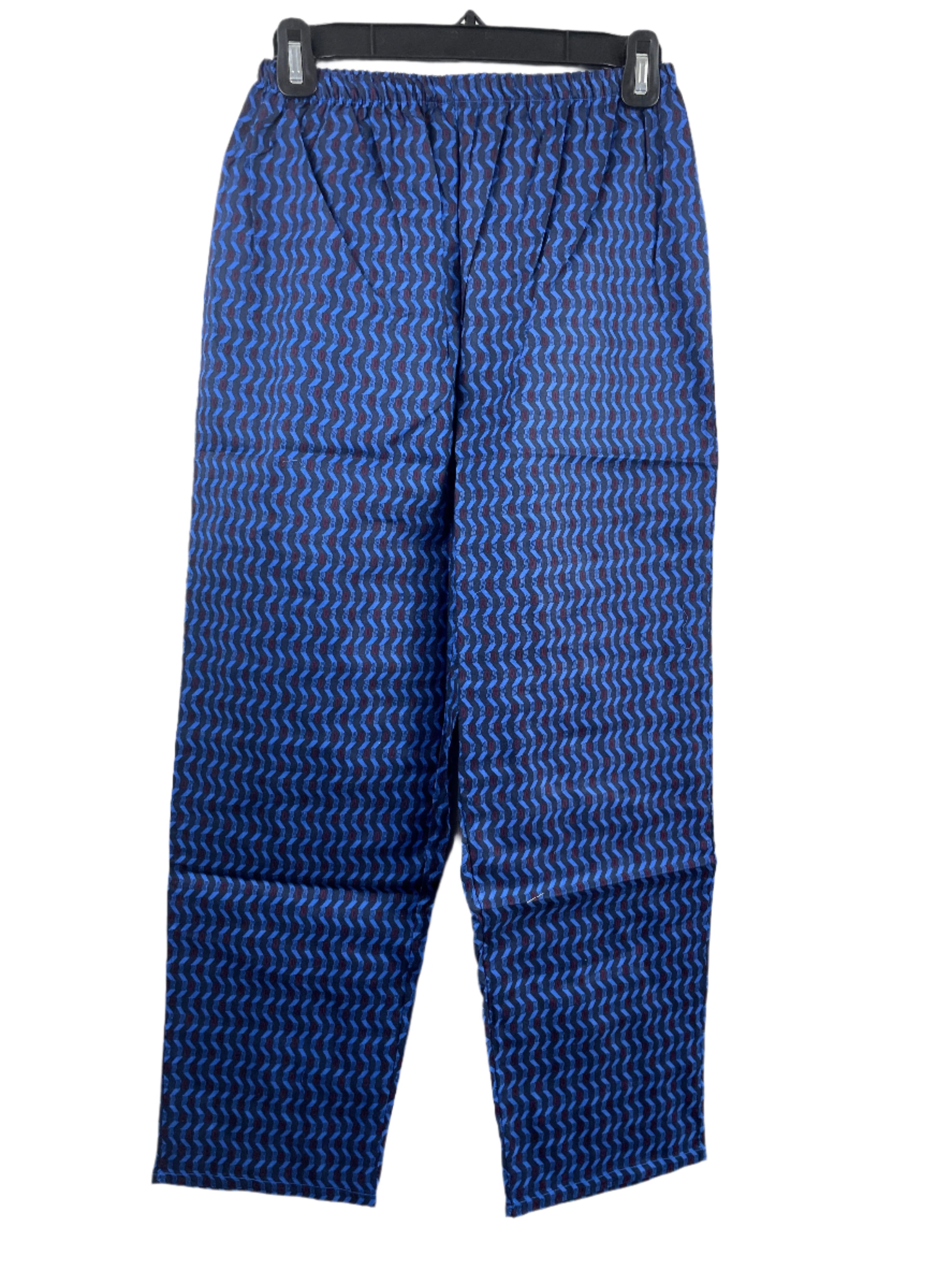Blue patterned pyjama pants on a hanger against a white background