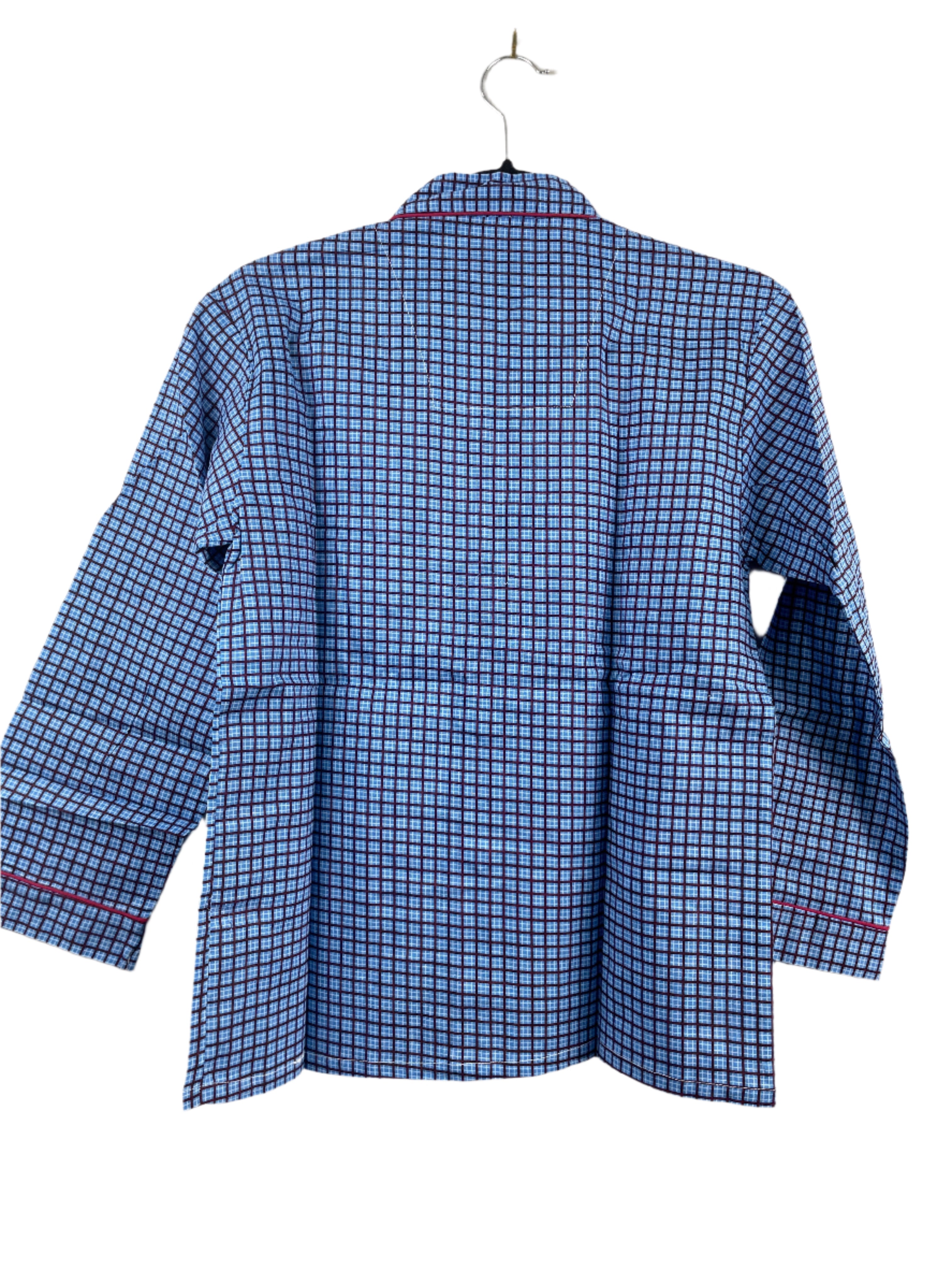 Blue checkered pyjama top on a hanger against a white background