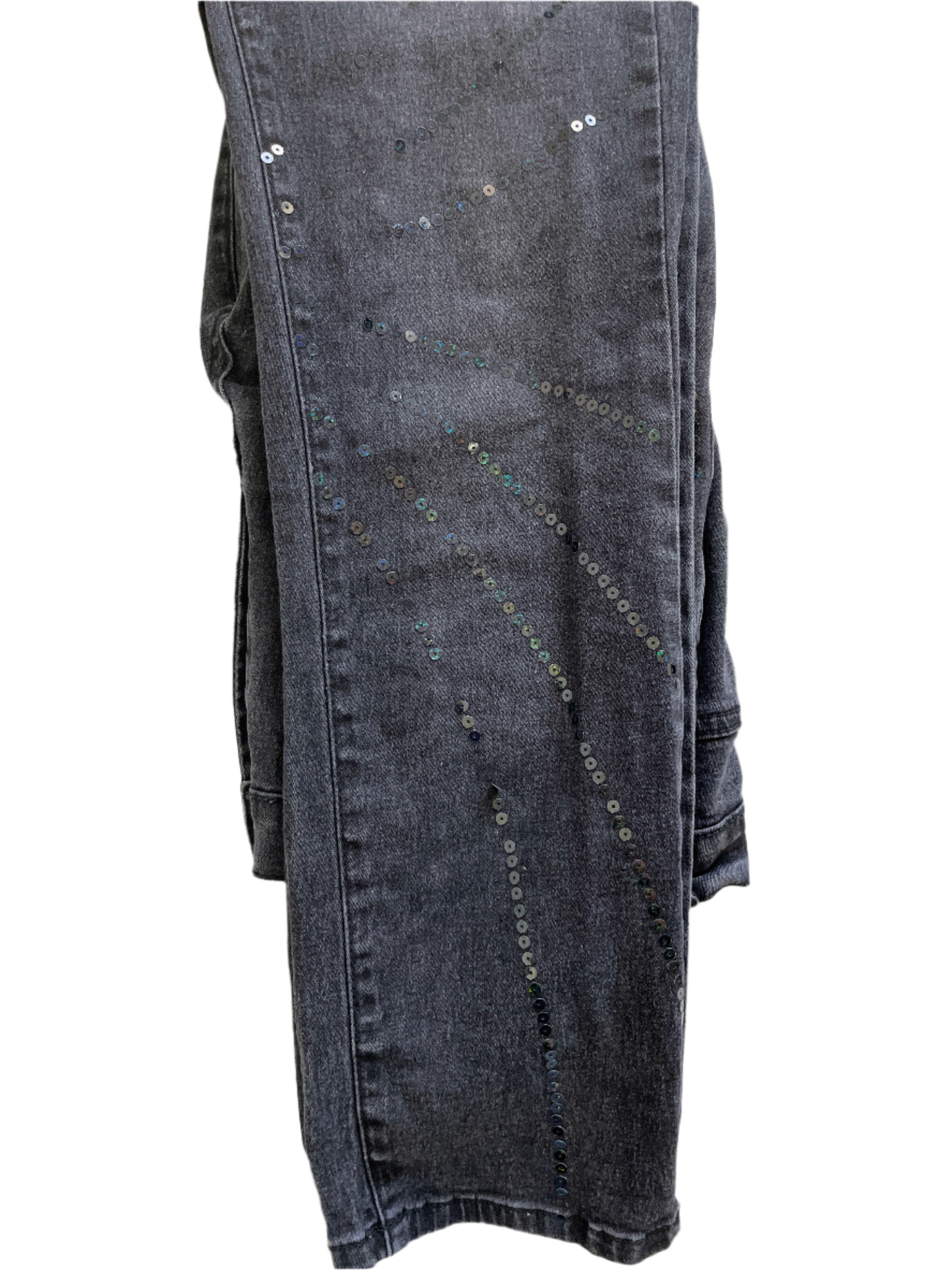 Black denim jeans with sequin details on a white background