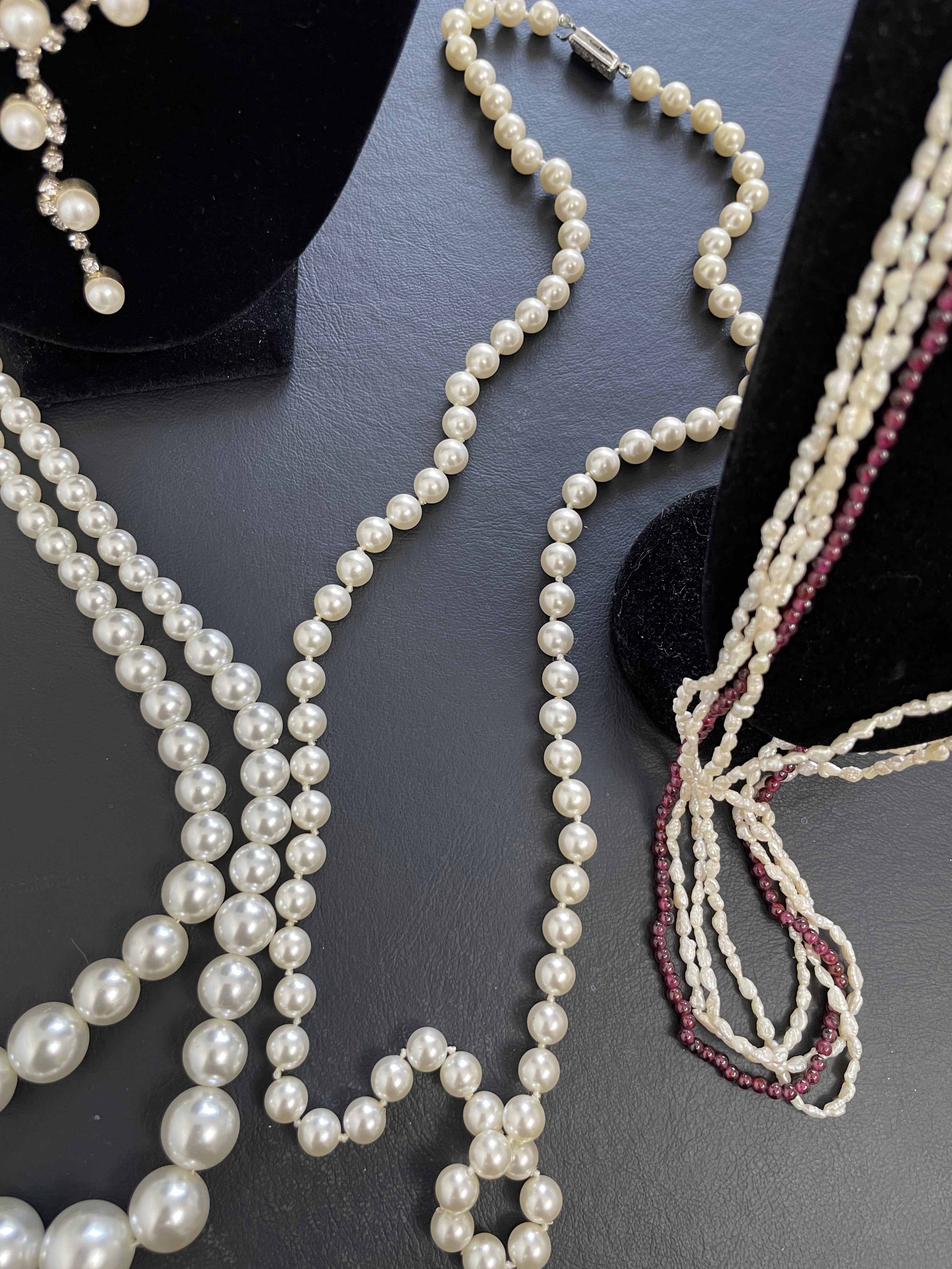 Pearl necklace on a dark surface