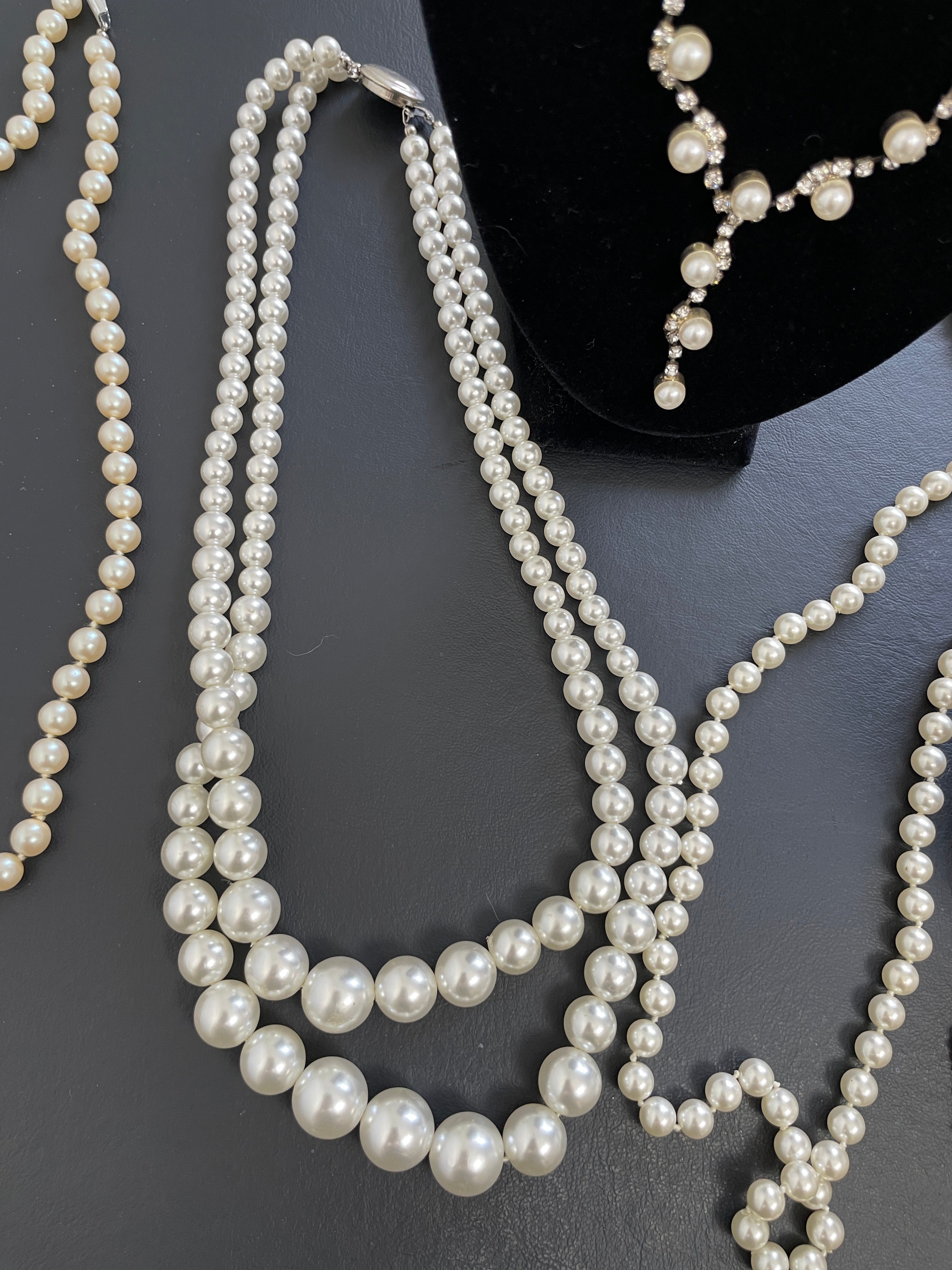 Pearl necklace on a dark surface