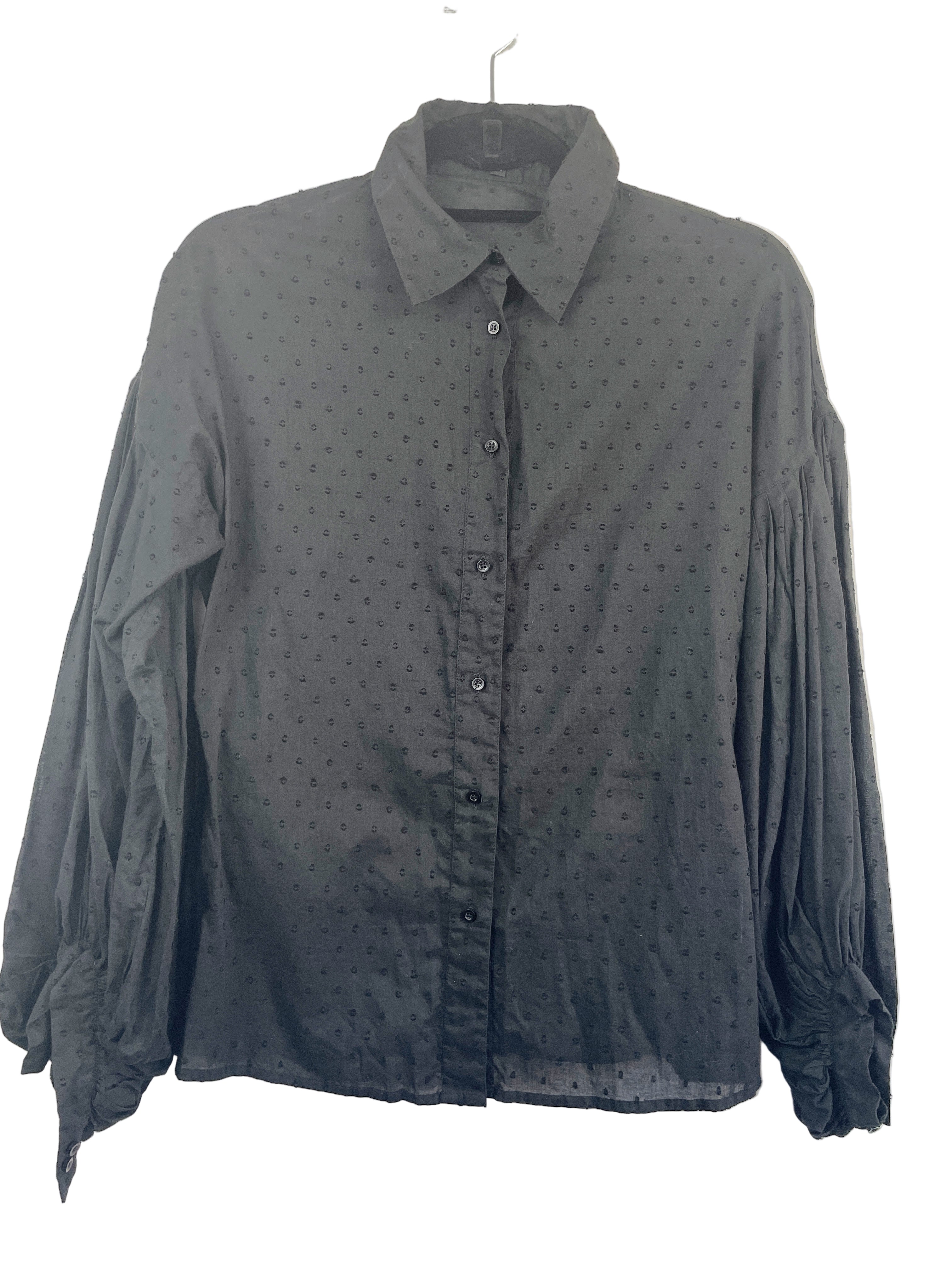 front view of Bel Air black polka dot bishop sleeve blouse