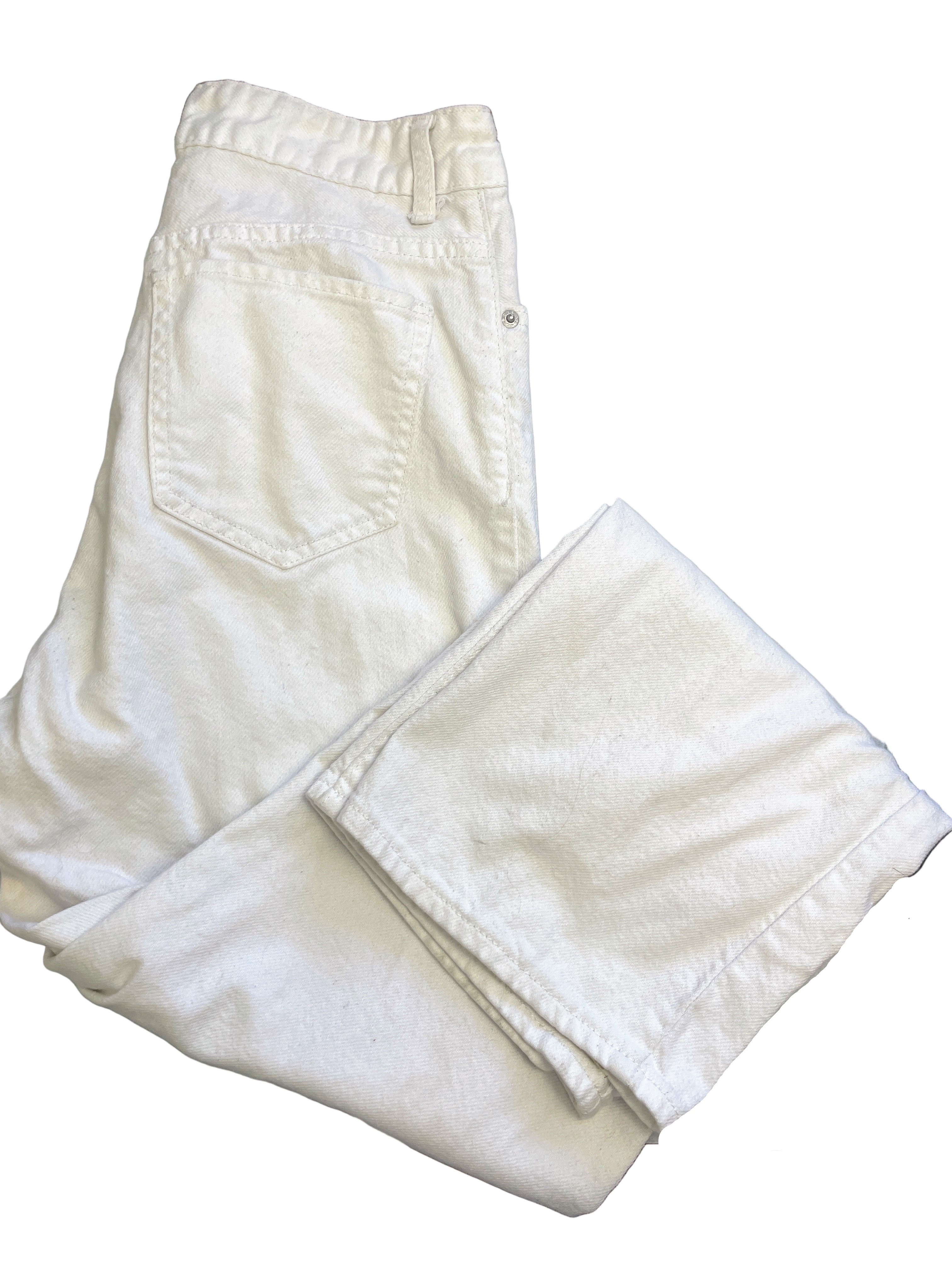 Folded front view of white S.O.N.G. 90s boyfriend jeans with button fly