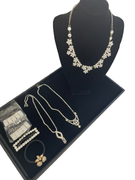 Rhinestone jewelry and hair accessory set with necklaces, hair ties, and barrette