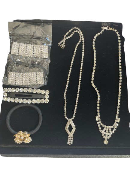 Rhinestone jewelry and hair accessory set with necklaces, hair ties, and barrette