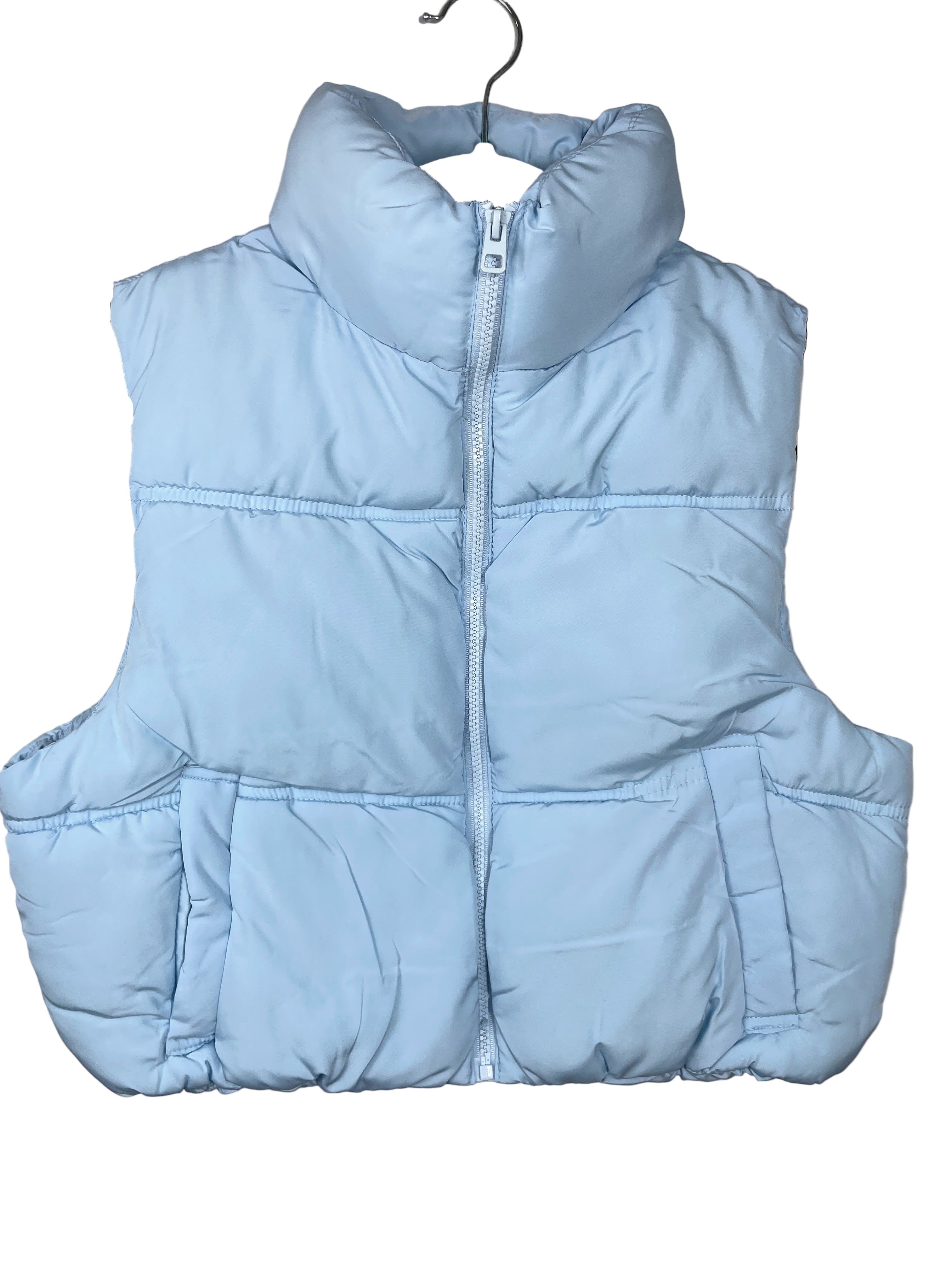 Light blue puffer vest on a hanger against a plain background
