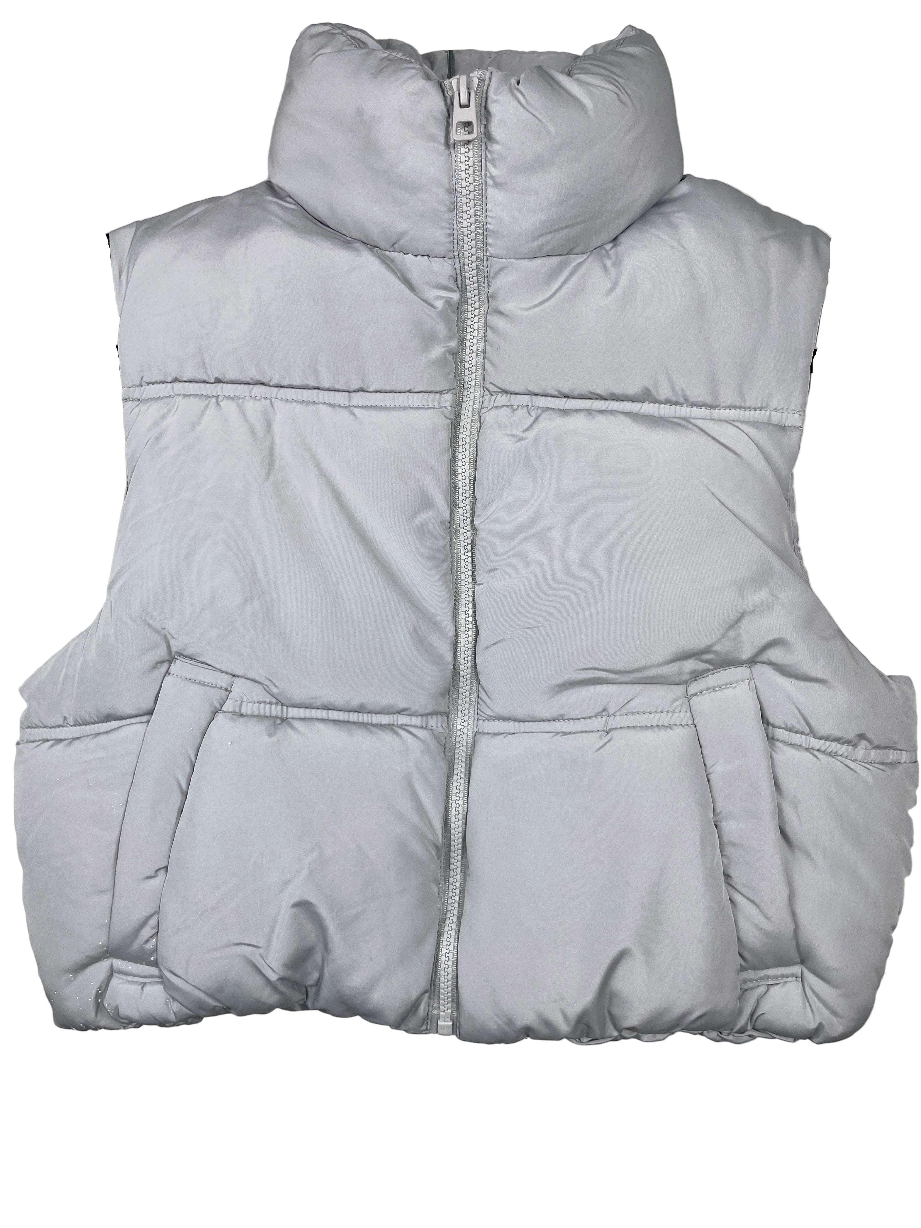 Gray puffer vest on a hanger against a white background