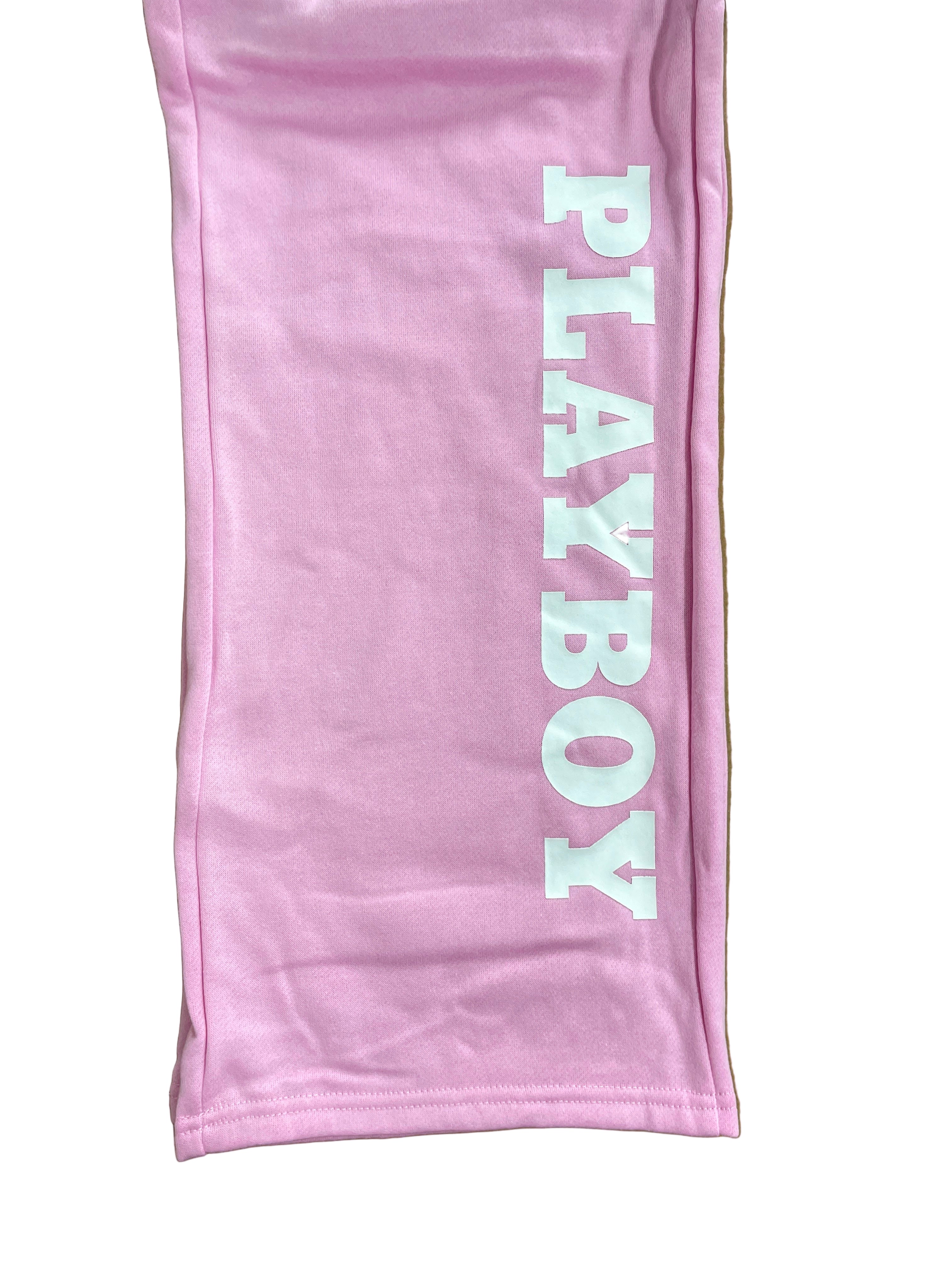 leg of pink sweatpants with Playboy written on leg
