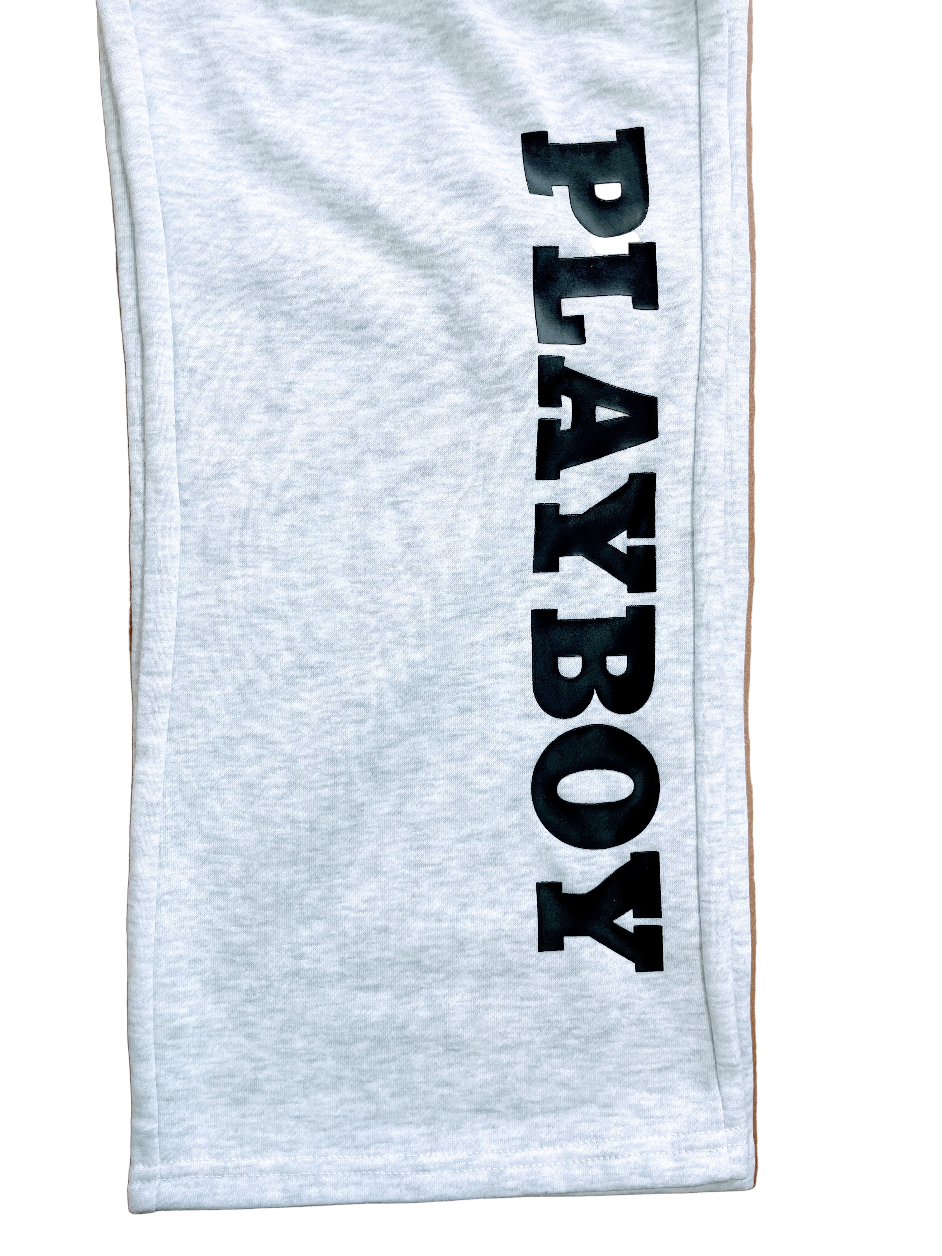 grey sweatpants with Playboy text on leg