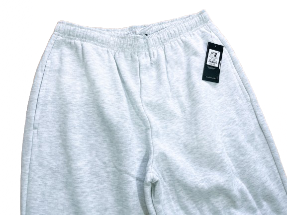 Gray sweatpants with a tag on a white background
