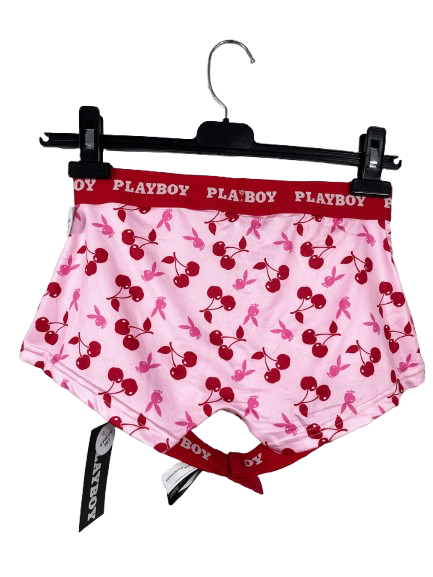 Pink boxer briefs with cherry pattern and red waistband on a hanger, featuring Playboy branding.