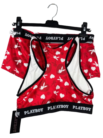 Playboy branded red underwear set with heart pattern on a hanger against a white background