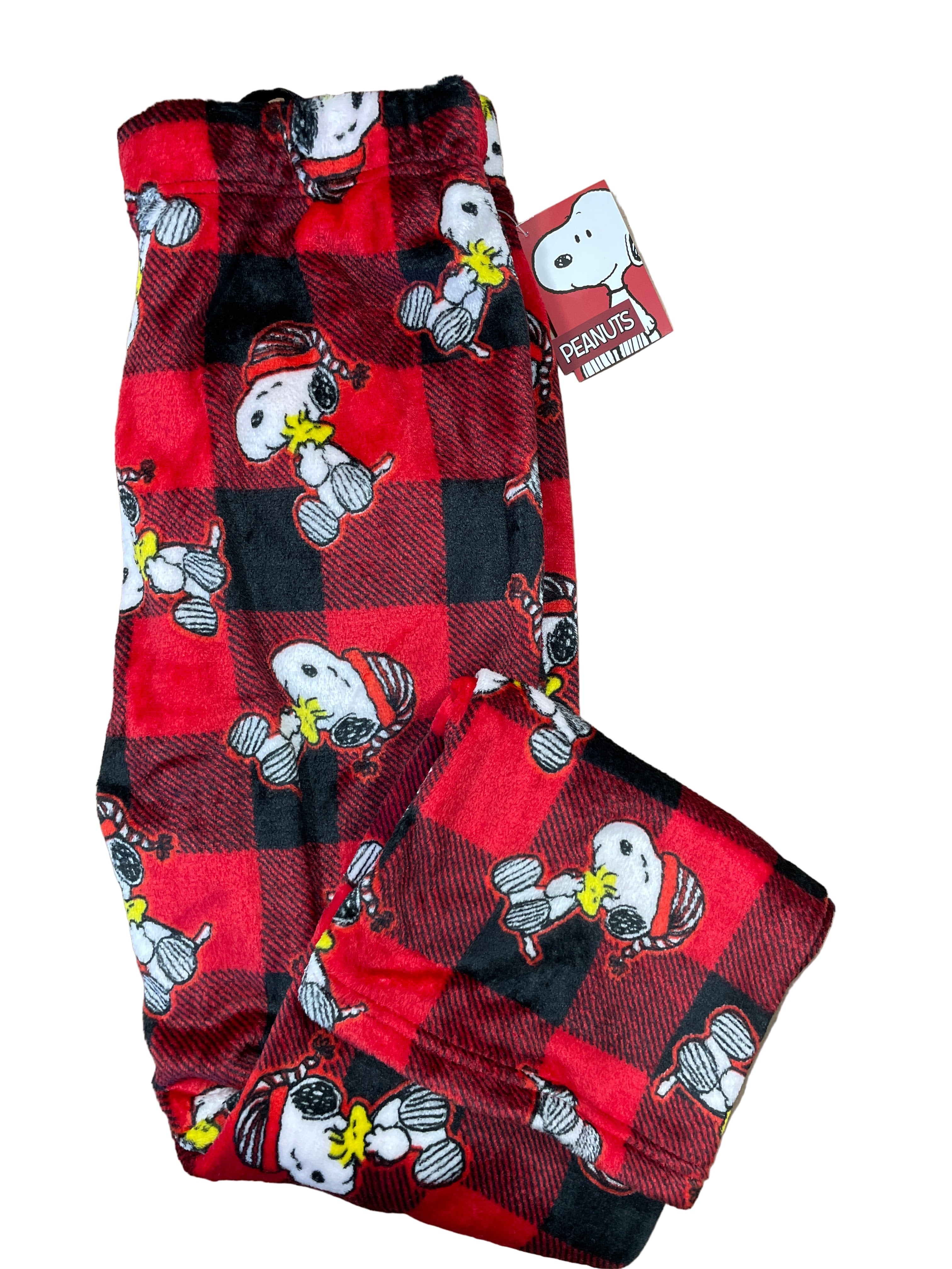folded Peanuts Snoopy plaid pyjama pants with festive print