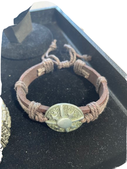 Bracelet with decorative clasp on a black stand