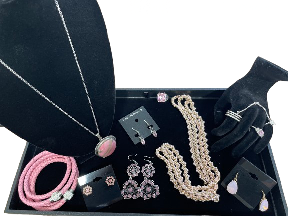 Complete 10-piece pink jewellery set on display tray