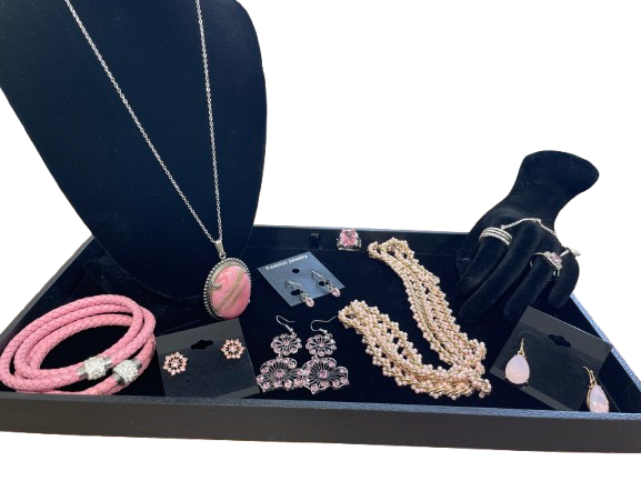 Complete 10-piece pink jewellery set on display tray