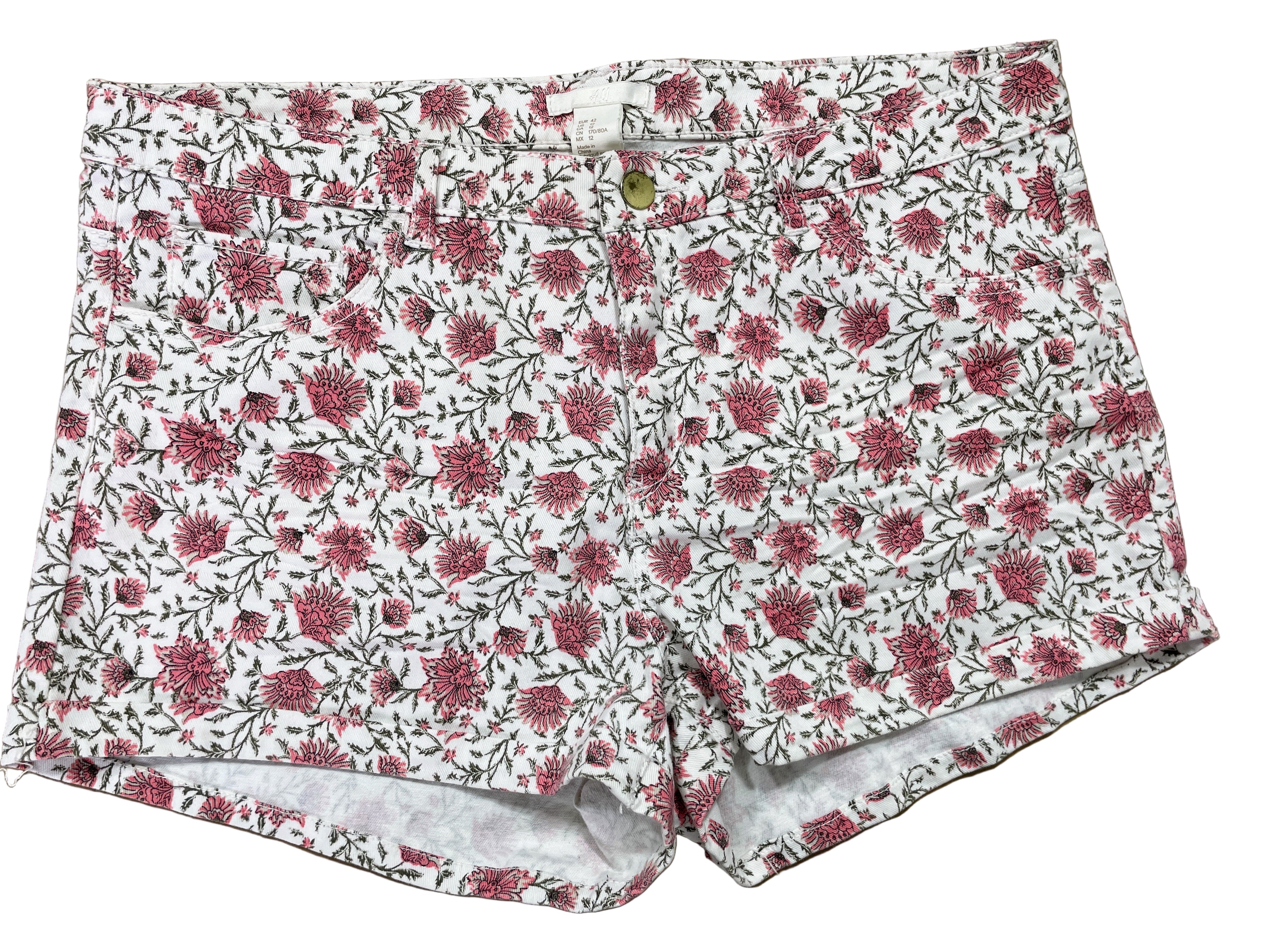 Front view of H&M white floral denim shorts size 12