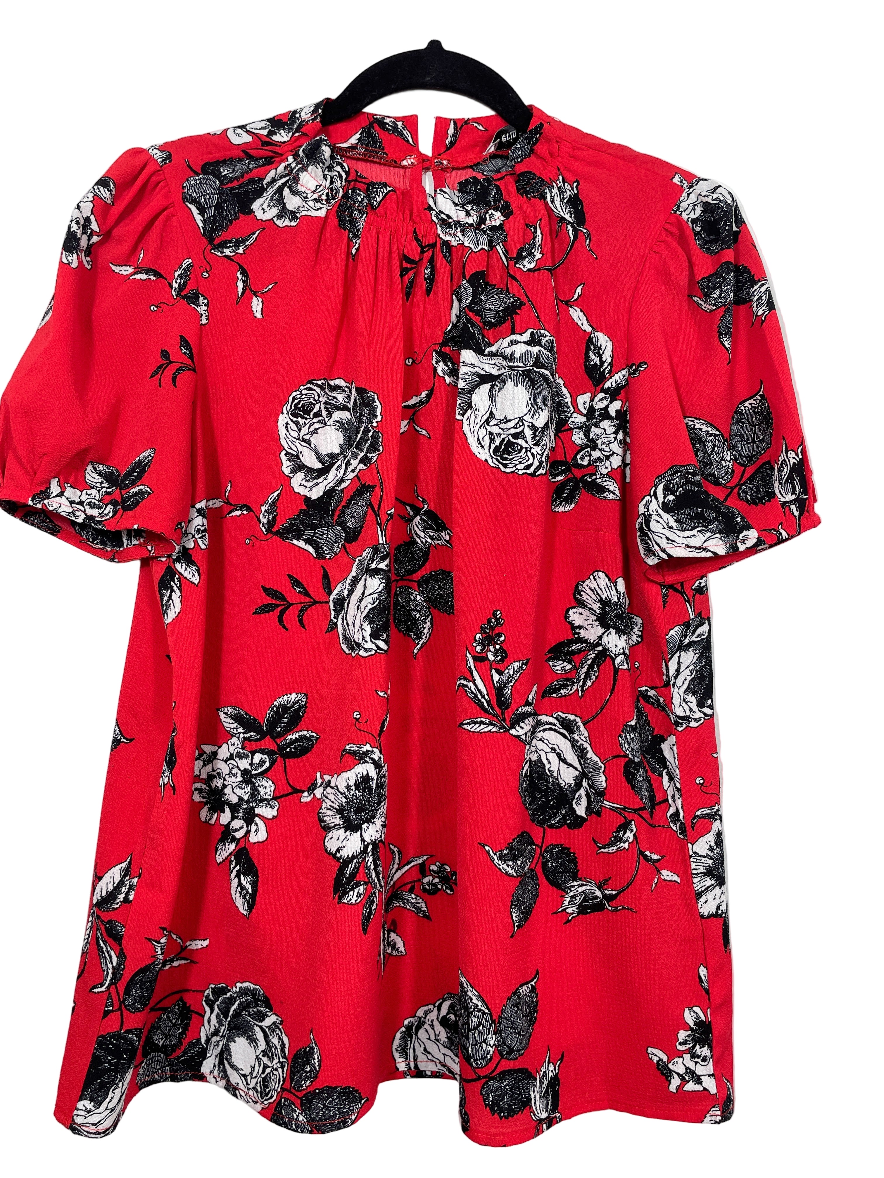 Front view of Erin Blair red floral blouse with short sleeves and elastic neckline.