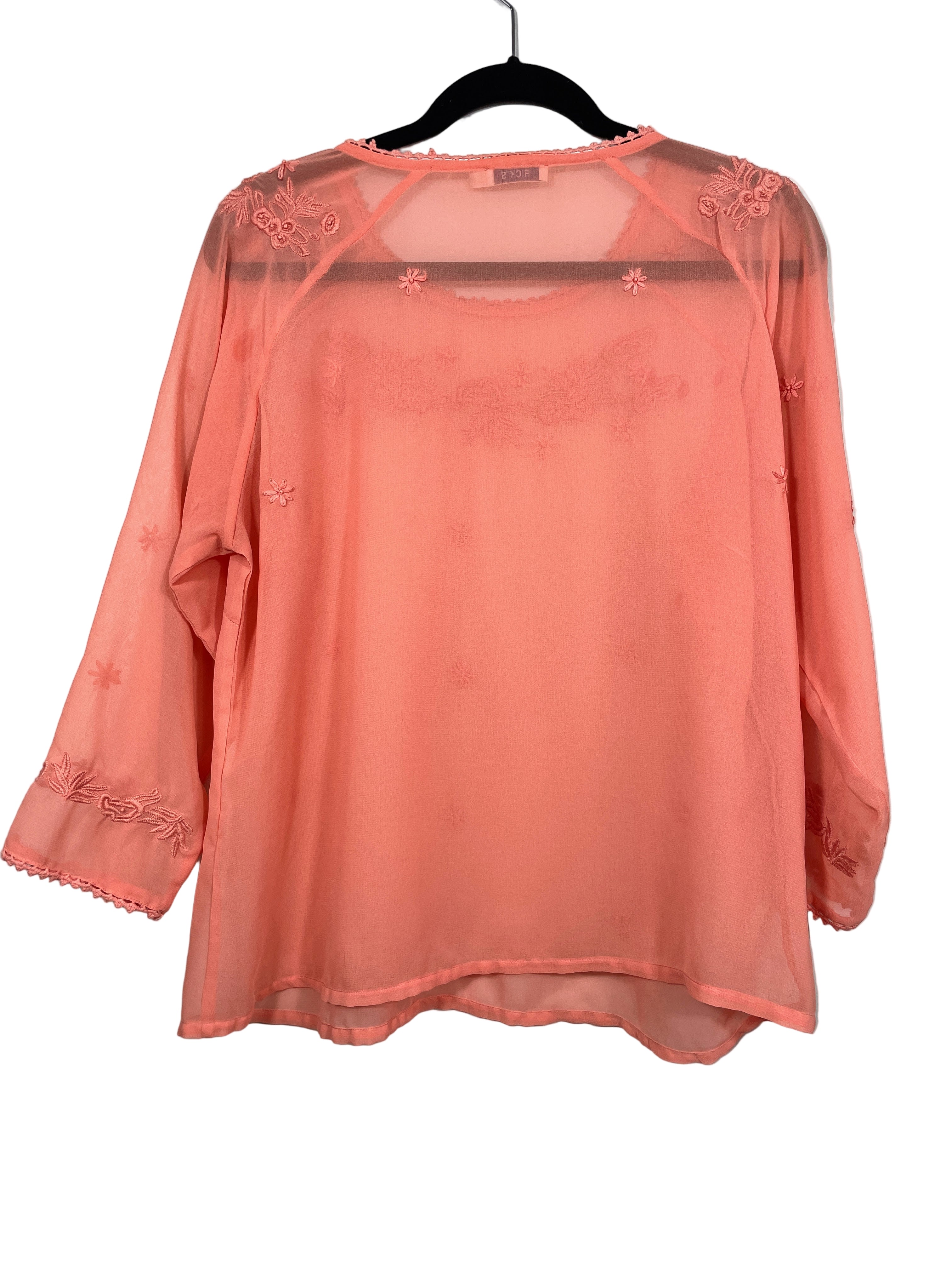 Back view of Ricki’s orange sheer blouse with embroidered floral detail – size 12