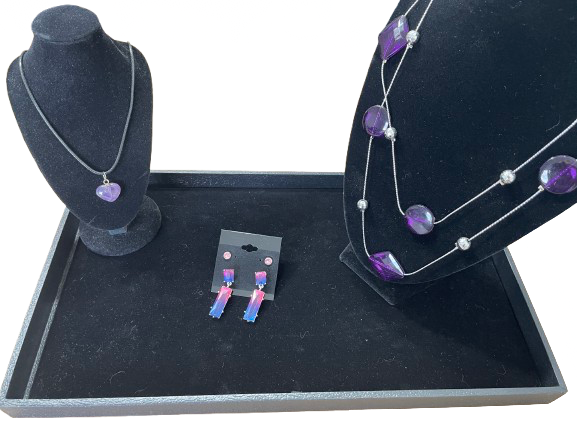 Full set of purple jewellery with two necklaces and two pairs of earrings displayed