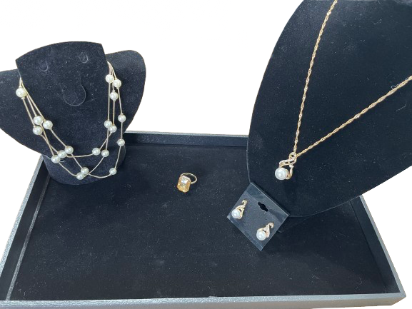 Gold and pearl costume jewellery set with layered pearl necklace, pearl pendant necklace and earrings, and large yellow stone dinner ring