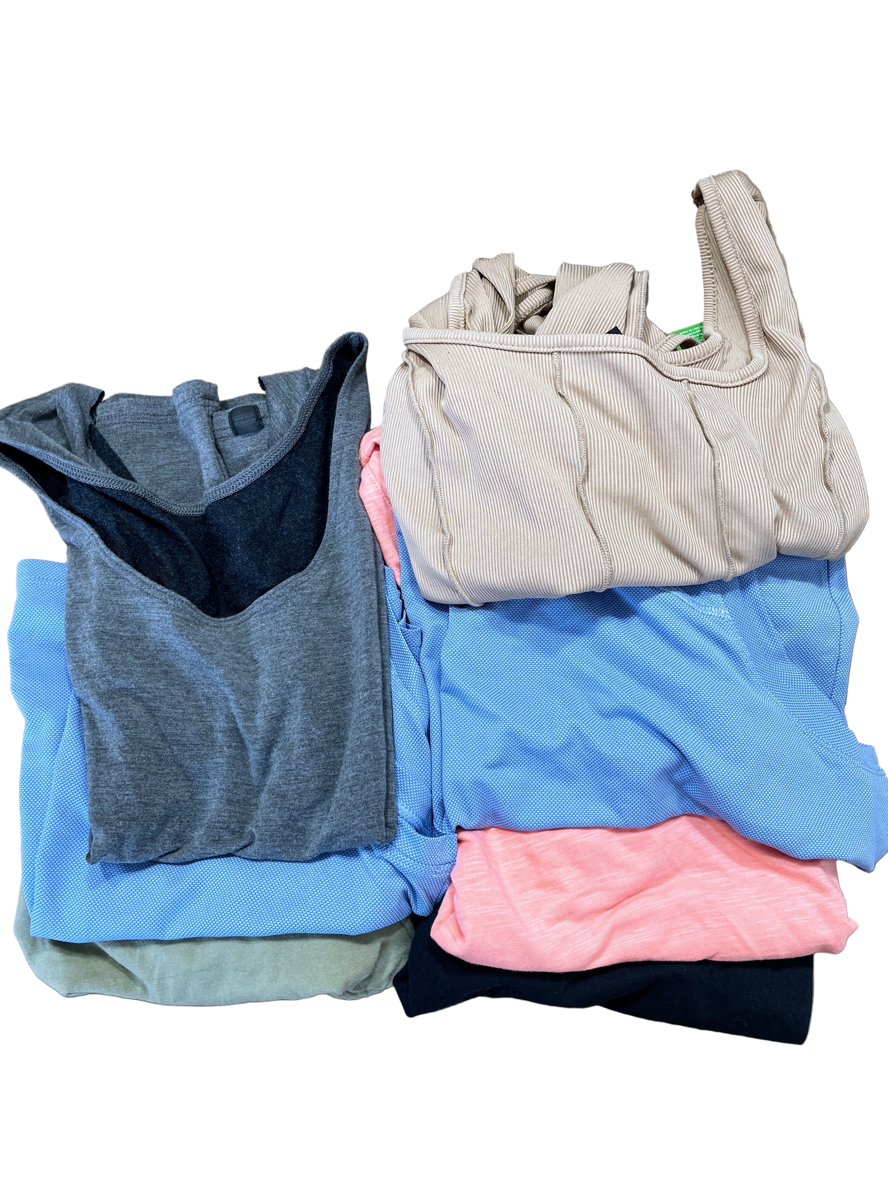 Lot of 7 assorted women’s tops in various colours and styles, size medium, folded together, front view