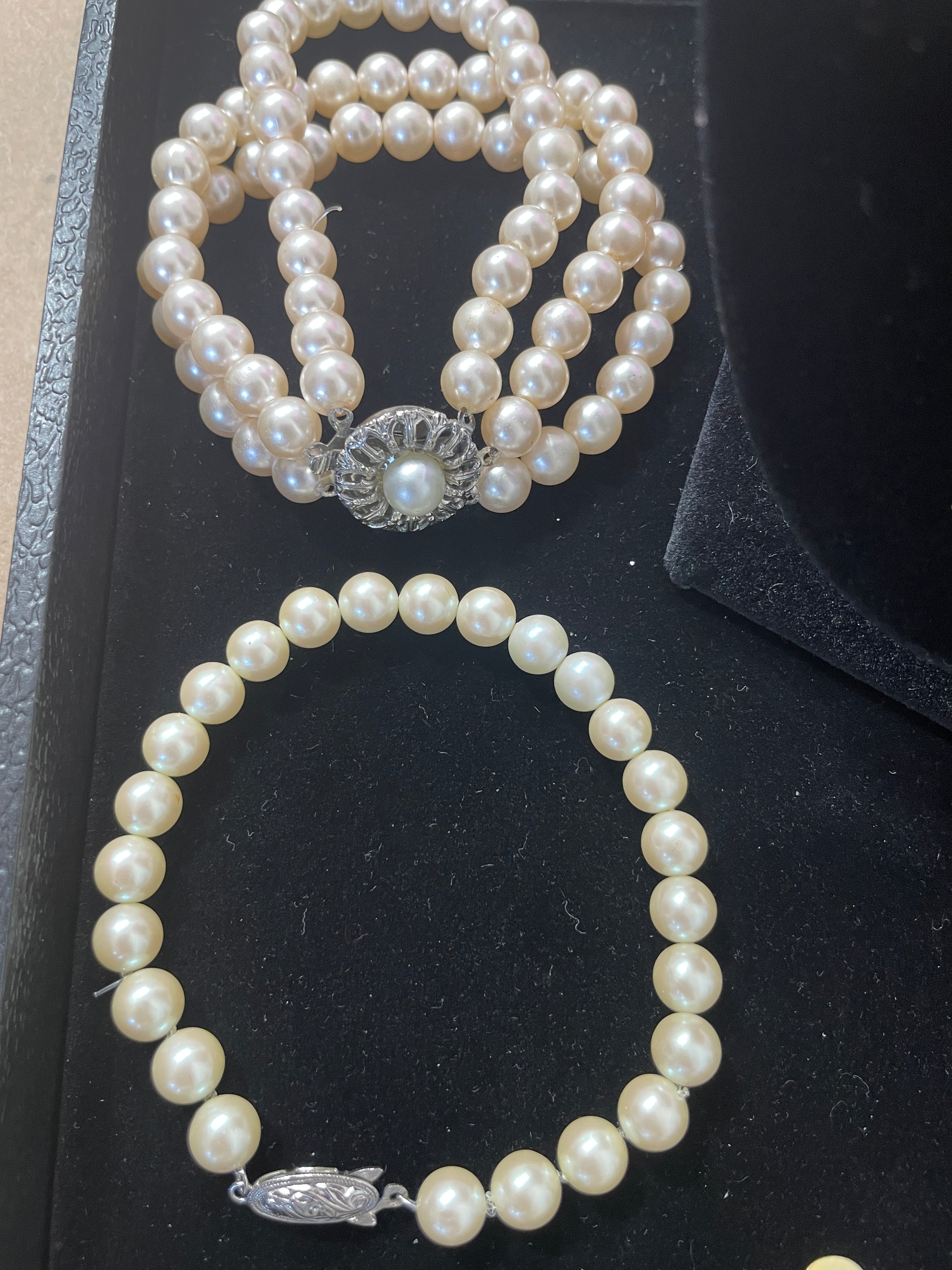 Faux pearl bracelets with ornate clasps