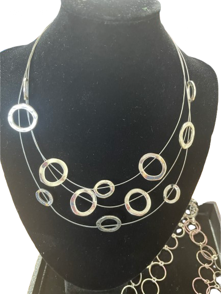 Multi-strand wire necklace with open circle accents