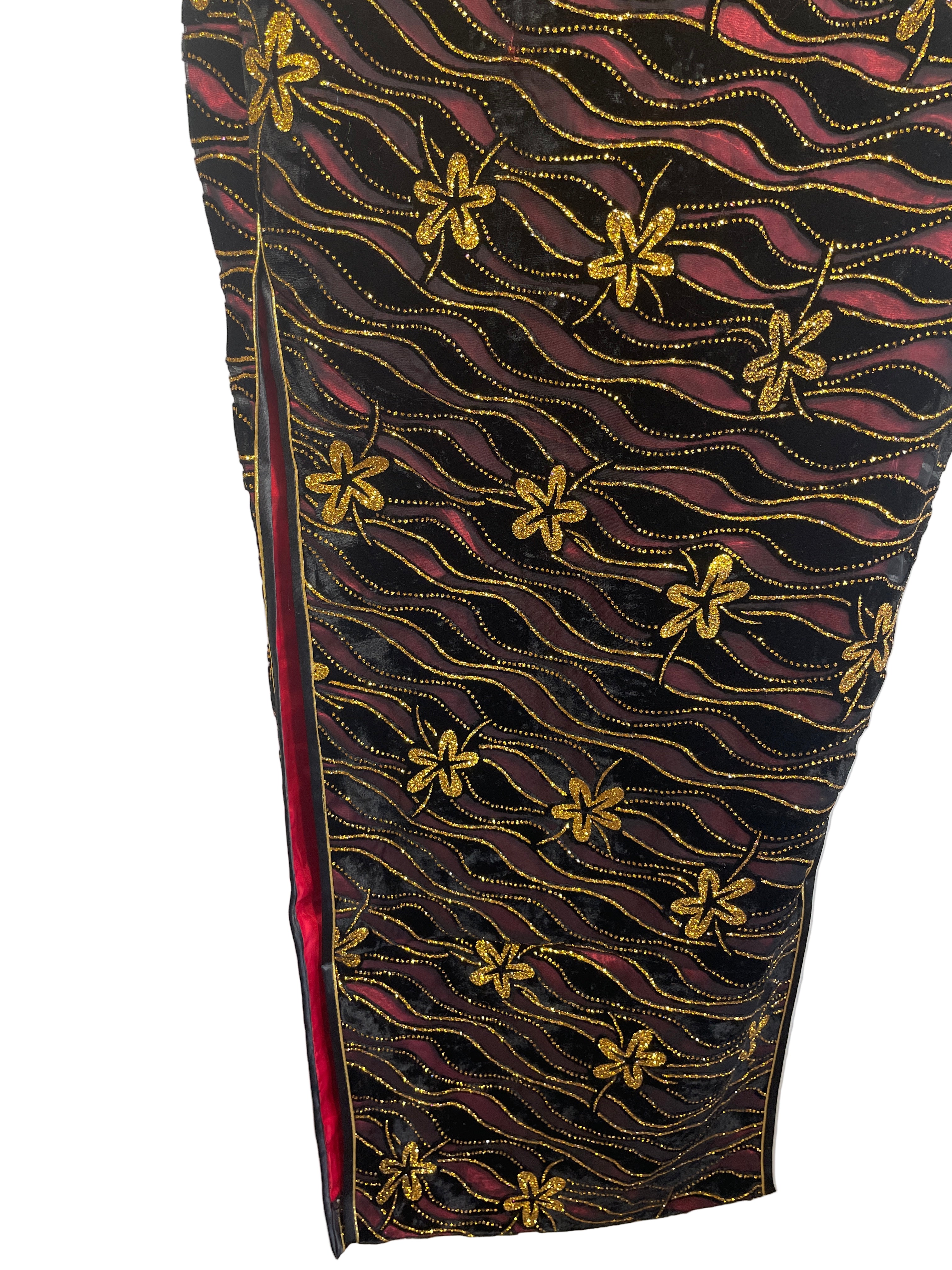 Decorative fabric with gold floral patterns on a black background