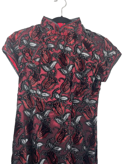 Close-up of red and black floral tulip brocade with shimmer detail