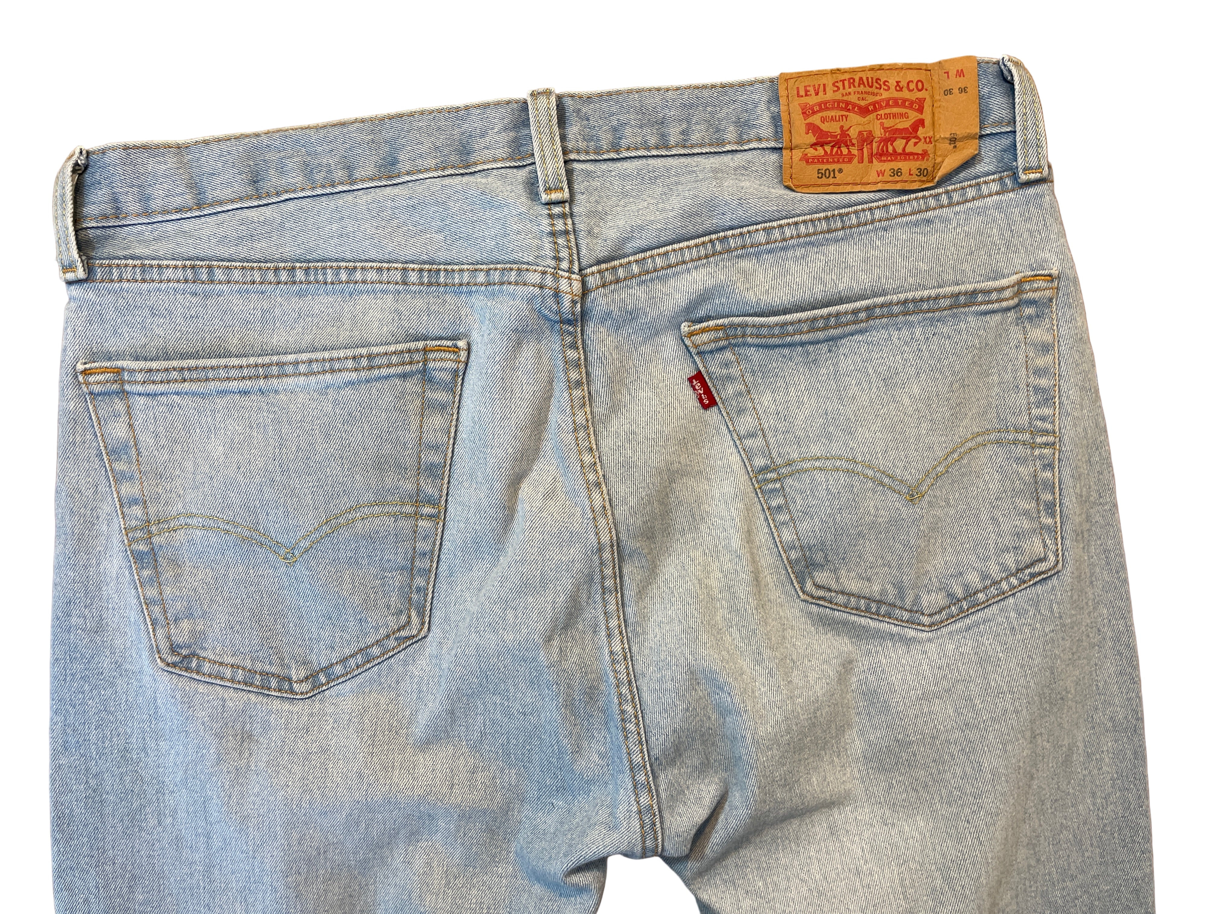 Back view of Levi’s 501 light wash men’s jeans with red tab and leather patch