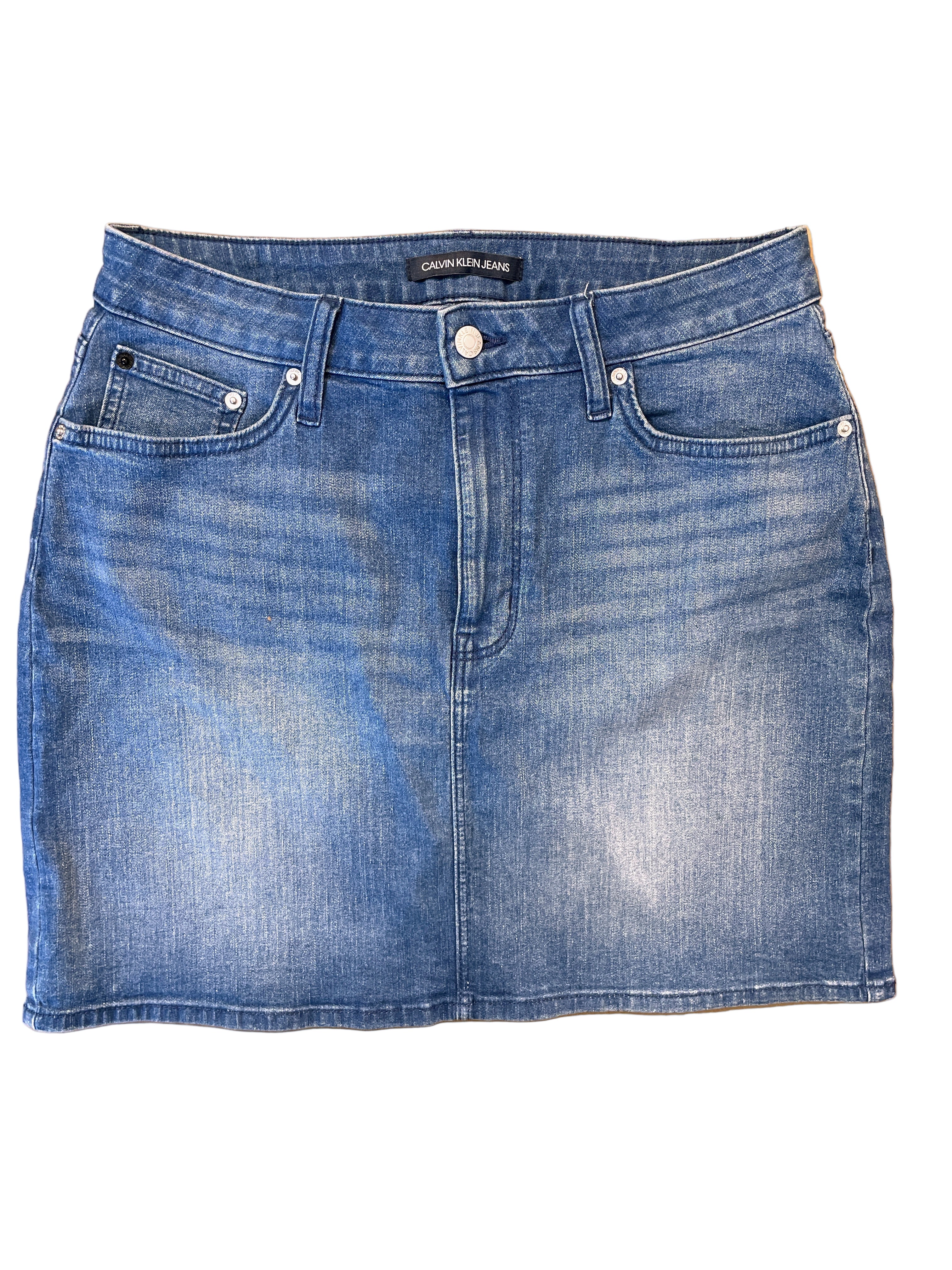 Front view of Calvin Klein medium wash denim skirt with five pockets
