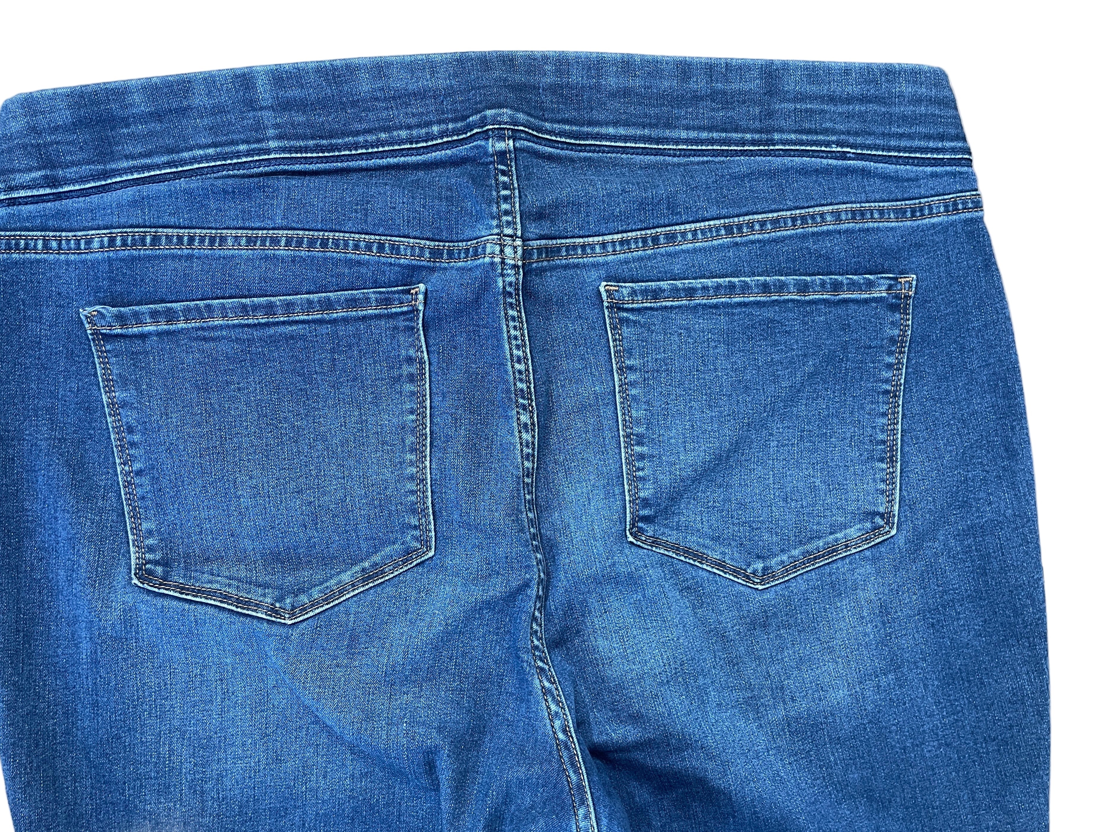 Blue jeans with a focus on the back pocket area.